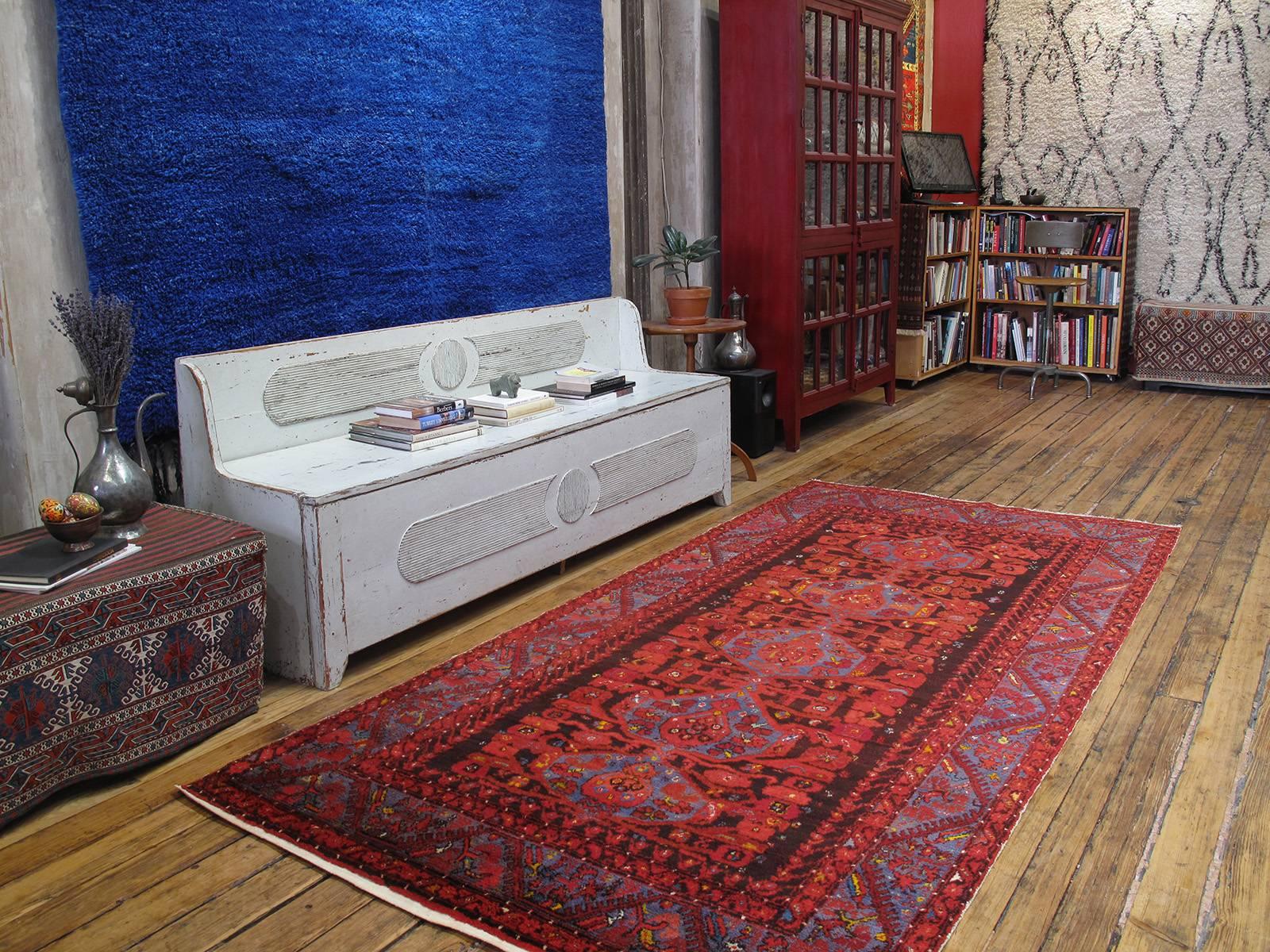 Kula Long rug. A lovely old example of this well-known type of rug from Kula, one of the most prolific weaving centers of Western Turkey. With tulips and carnations and a profusion of other stylized floral forms, these rugs are direct descendants