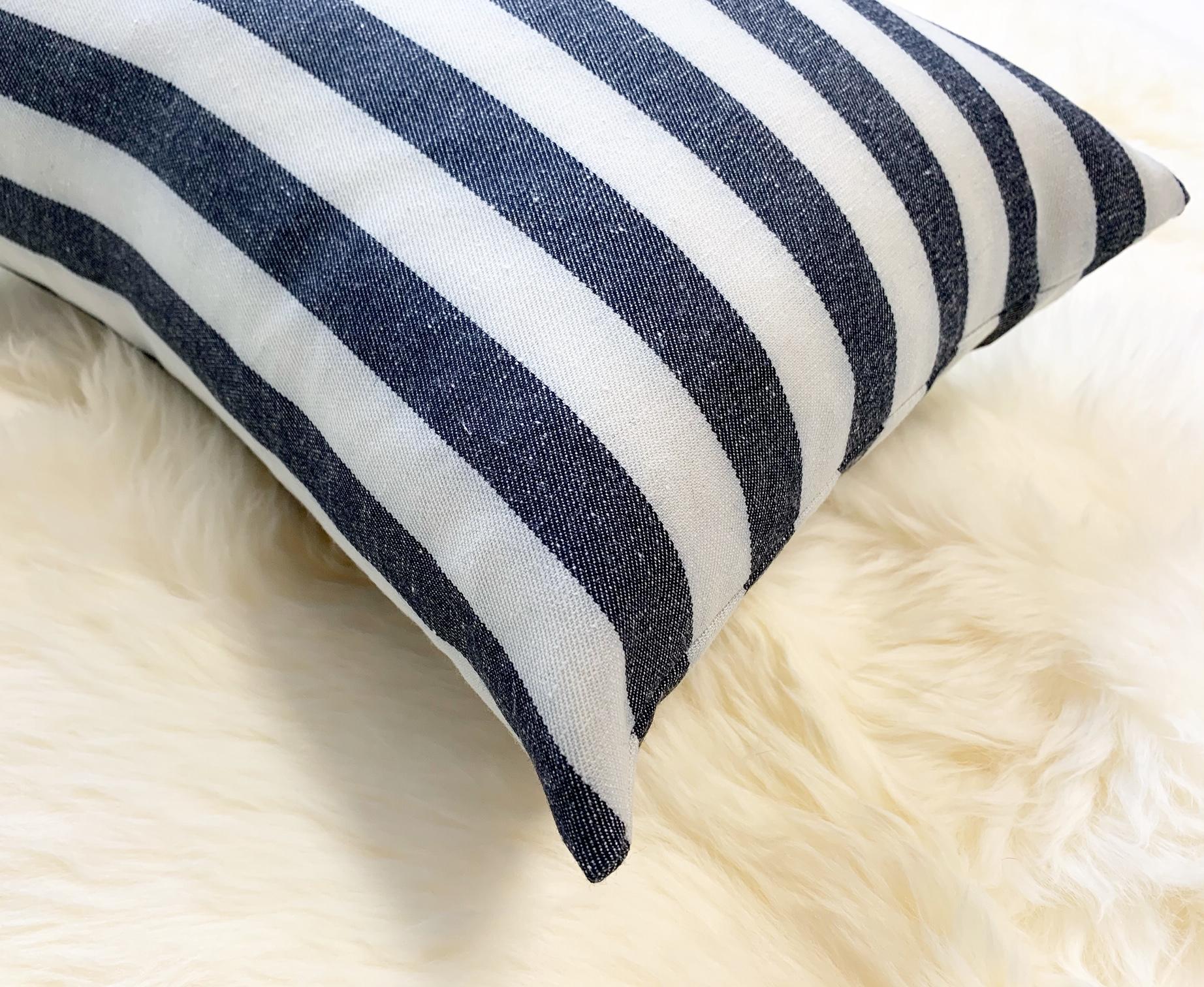 Kule's incredibly chic stripe fabric was used to make this beautiful pillow crafted in our Saint Louis studio. Down feather insert included. Measures: 11 x 16”.