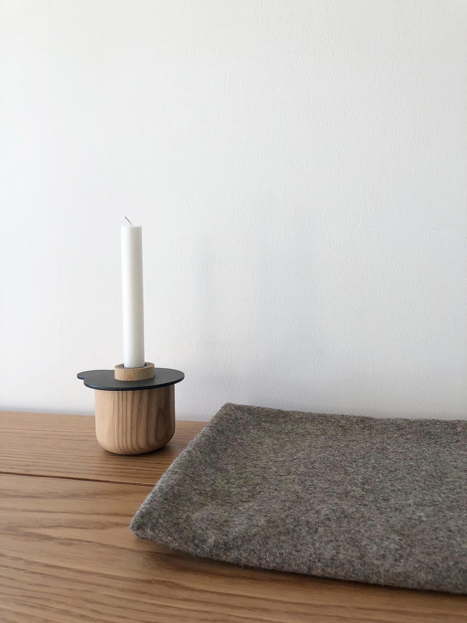 Kumo means cloud in Japanese and is inspired by the subtle curves of clouds 
Kumo is a minimal candle holder made of laser cut steel and oak handcrafted. 
The steel is painted by a light color palette inspired on how clouds reflect natural colors