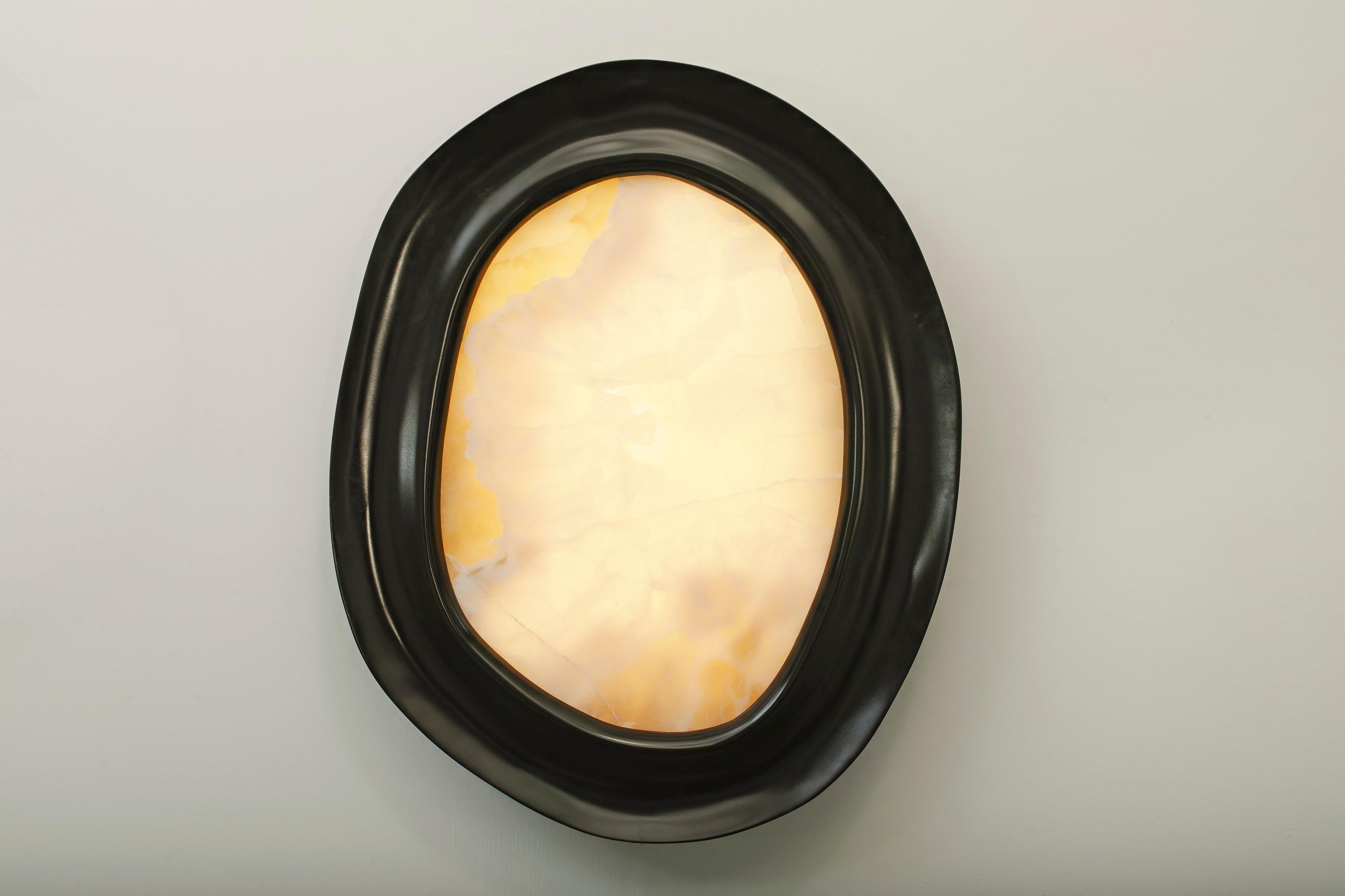 Kumo wall light by Thomas Trad 
2019
Dimensions: Varies between 70 and 80 cm in diameter
 10 cm in depth
Materials: Wood, pink onyx, LED light

Hand carved wall light.

Thomas Trad is a product designer from Beirut. An alumnus of London's