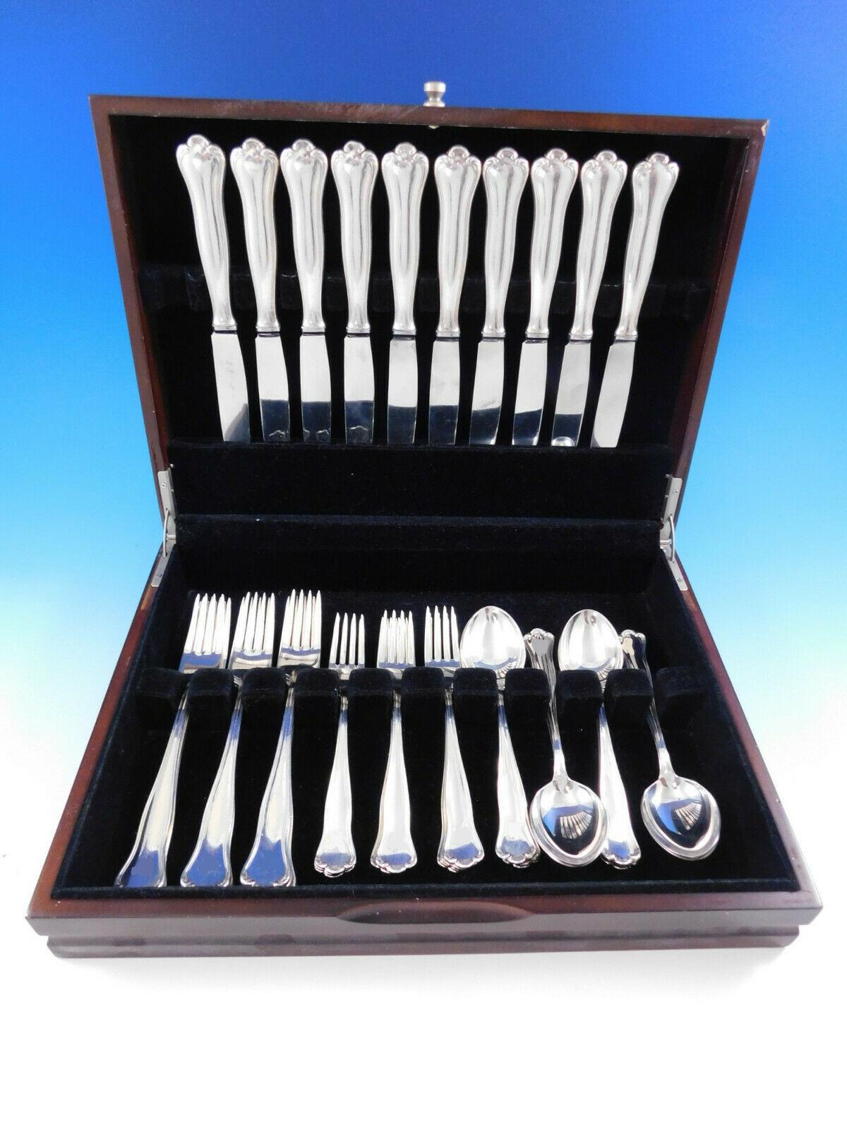C.G. Hallberg .830 silver Swedish dinner size flatware set - 40 pieces. This set includes:

10 dinner size knives, 9 3/4