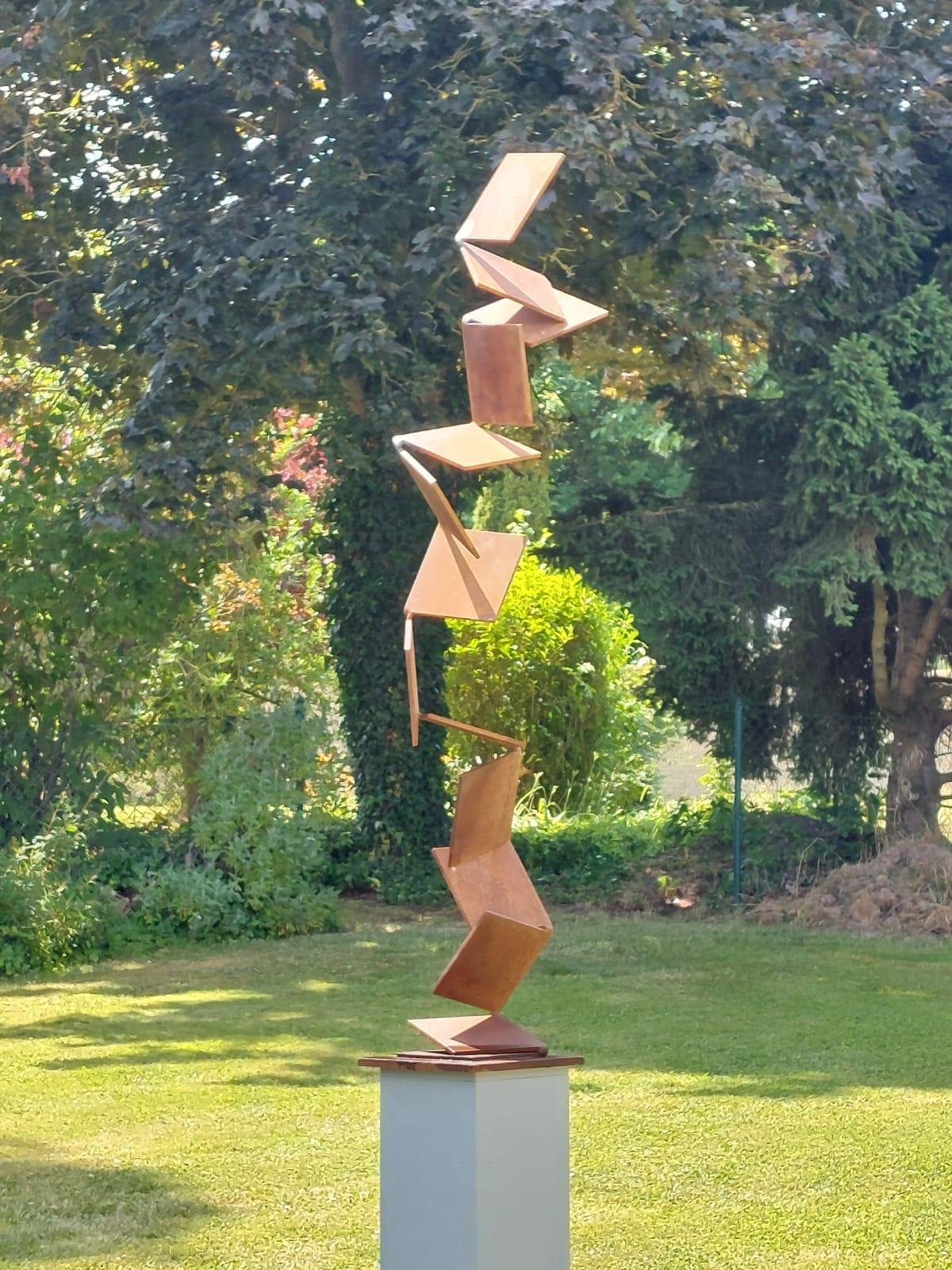 This beautiful large corroded steel  sculpture can be used for indoor or outdoors. It makes for an elegant statement in any garden, lobby or private home.

Base dimensions are 30 x 30