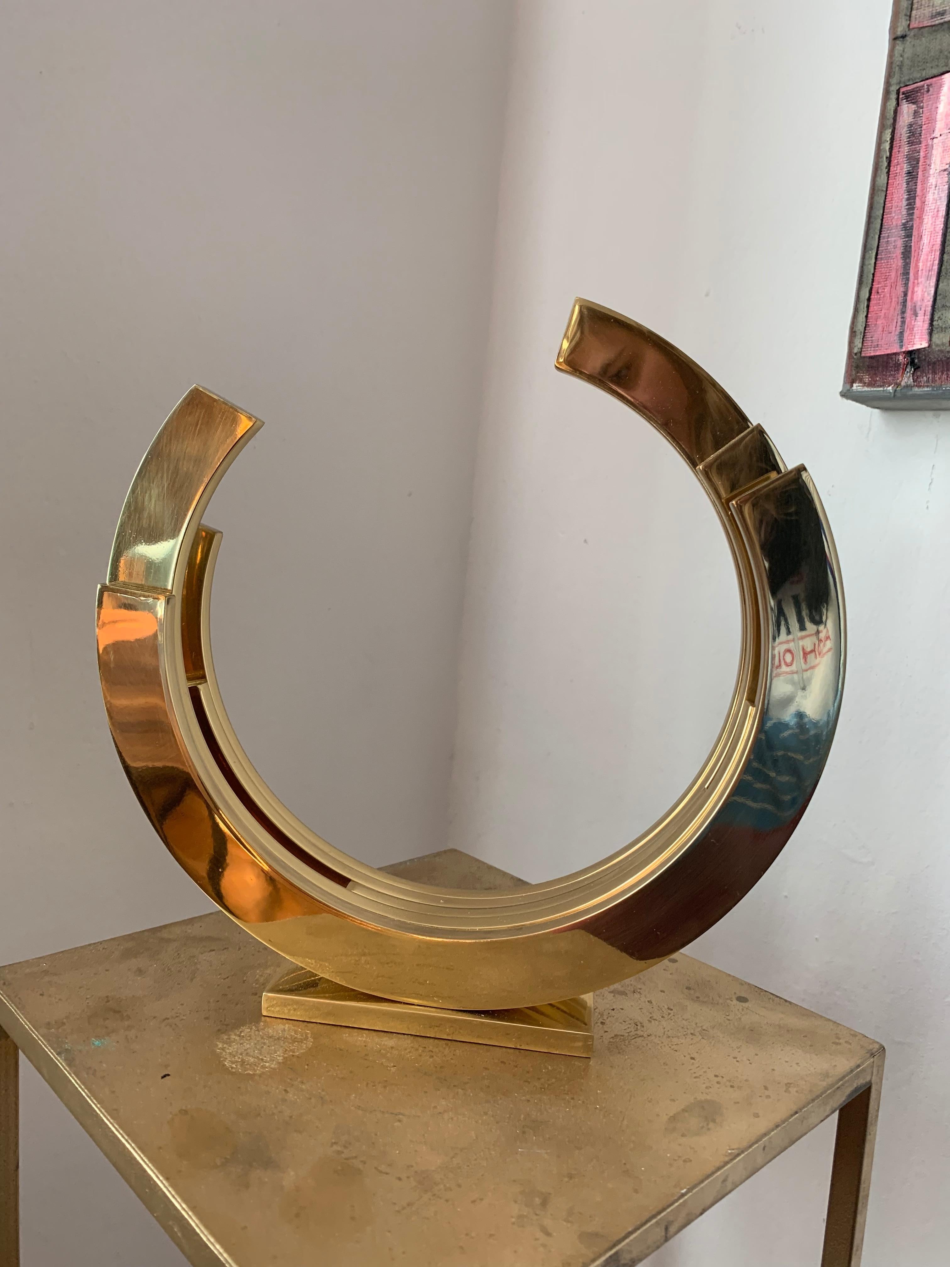 Contemporary Minimal Gold Brass sculpture, gilded and then lacquered to keep its shiny surface.
Limited edition of 10
Kuno Vollet is a sculptor working with different materials such as clay, bronze and brass. 
Other works are not cast but heated and