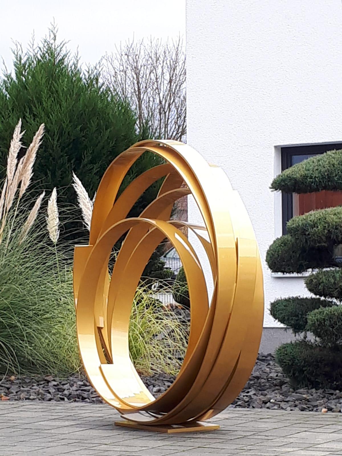 Very large Contemporary powder coated aluminum sculpture for inside or garden outdoor spaces.
Beautiful spiral dancing and intertwining.

This is a large scale outdoor or indoor sculpture made from aluminum and then powder coated in a golden