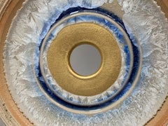 Infinity Diamond by K. Vollet - gold, blue circular sculpture on granite base