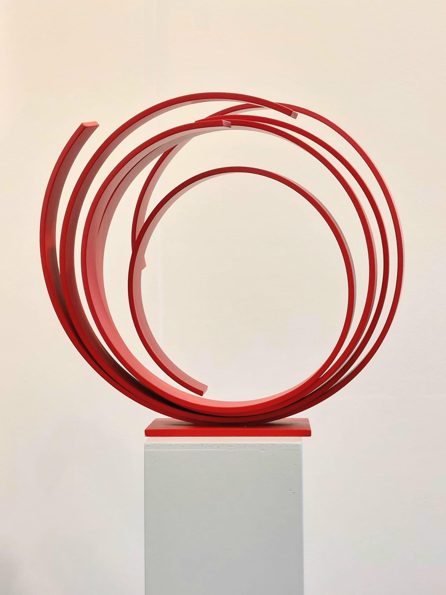 A large contemporary red powder coated steel sculpture. Beautiful on the floor or a pedestal. 
A contemporary statement piece full of elegance and movement.
_______________________________________________________________________

Born in 1951 in