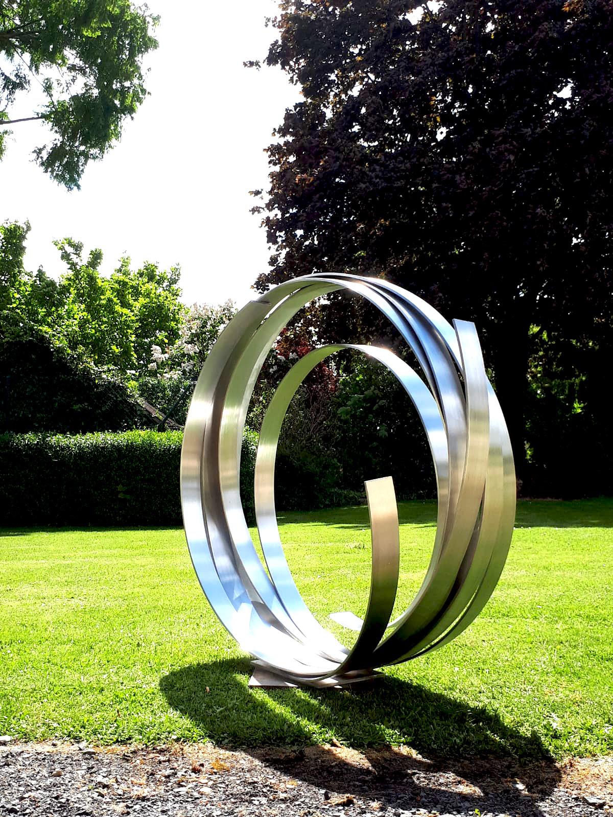 Artist: Kuno Vollet

Title: Silver Orbit

Very large Contemporary stainless steel sculpture for inside or garden outdoor spaces.

Beautiful spiral dancing its way towards the sky.