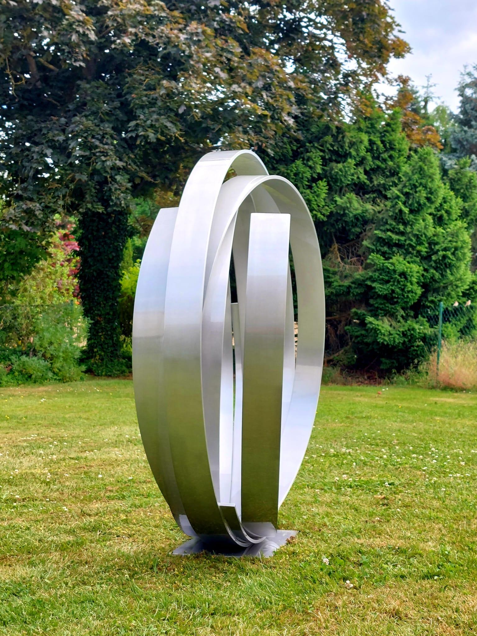 Very large Contemporary powder coated aluminum sculpture for inside or garden outdoor spaces.
Beautiful spiral dancing and intertwining.

This is a large scale outdoor or indoor sculpture made from aluminum and then powder coated in a bold red.
We