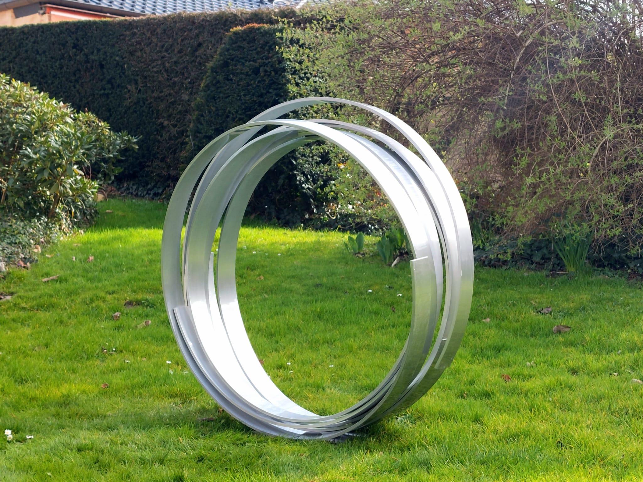 Very large Contemporary powder coated aluminum sculpture for inside or garden outdoor spaces.
Beautiful spiral dancing and intertwining.

This is a large scale outdoor or indoor sculpture made from aluminum and then powder coated in a bold red.
We