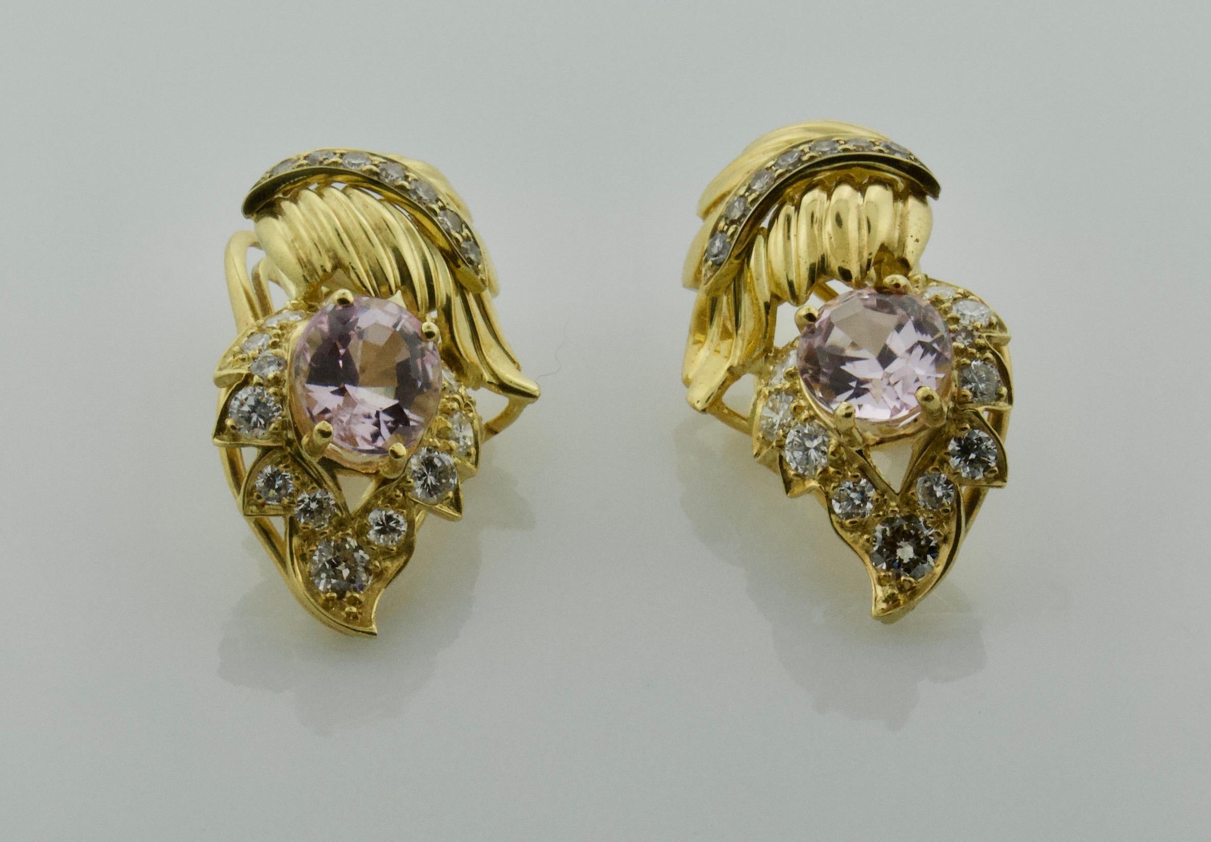 Kunzite and Diamond Leaf Design Earrings in 18k Circa 1960's 
Handmade Left and Right
Two Oval Cut Kunzites weighing 5.50 carats approximately [bright with no imperfections visible to the naked eye]
Thirty Four Round Diamonds weighing 1.70 carats