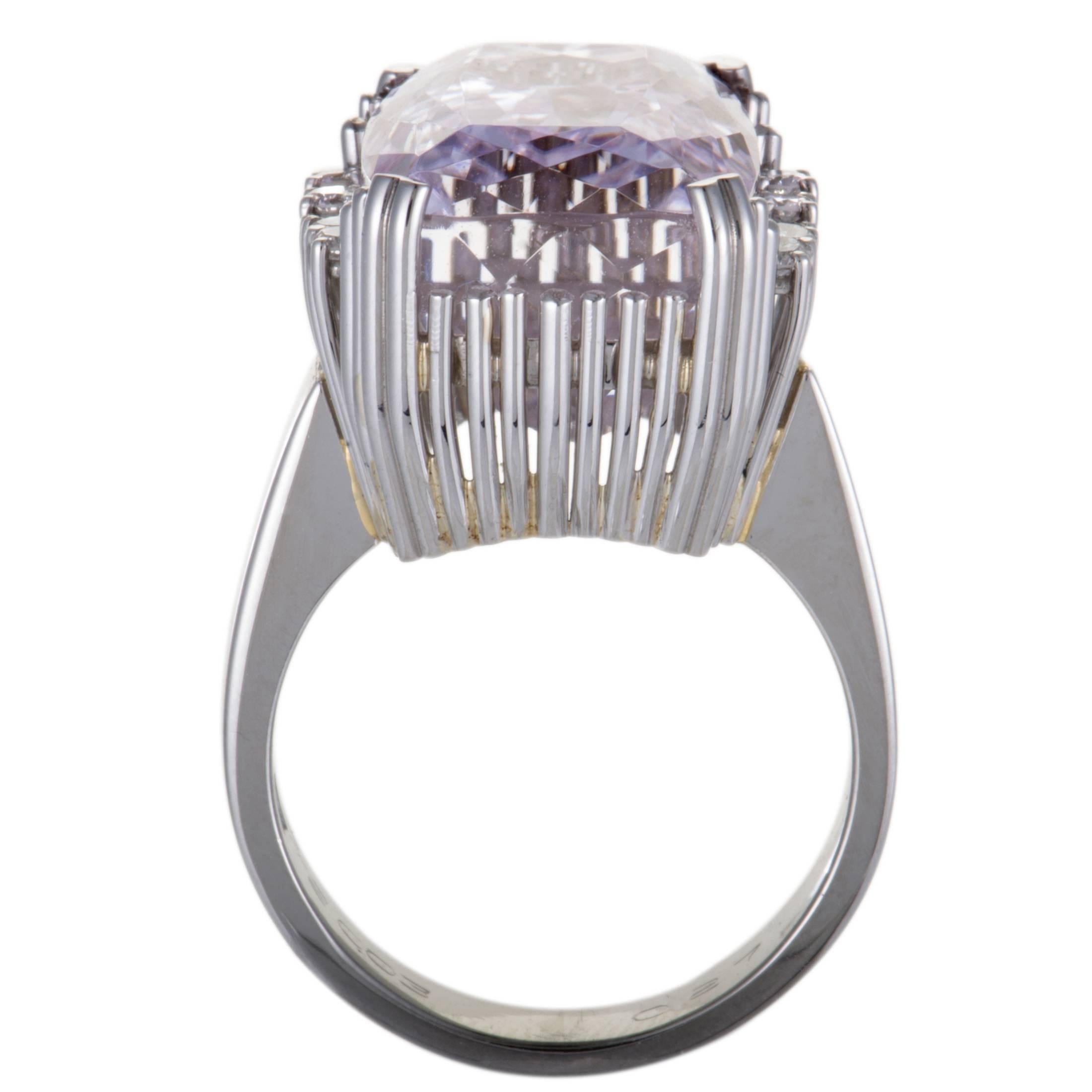 Wonderfully bright-toned and luxurious, this spellbinding ring boasts a strikingly offbeat design and enchanting décor. The ring is made of platinum and set with 0.24 carats of sparkling diamond stones that gorgeously accentuate the sublime kunzite