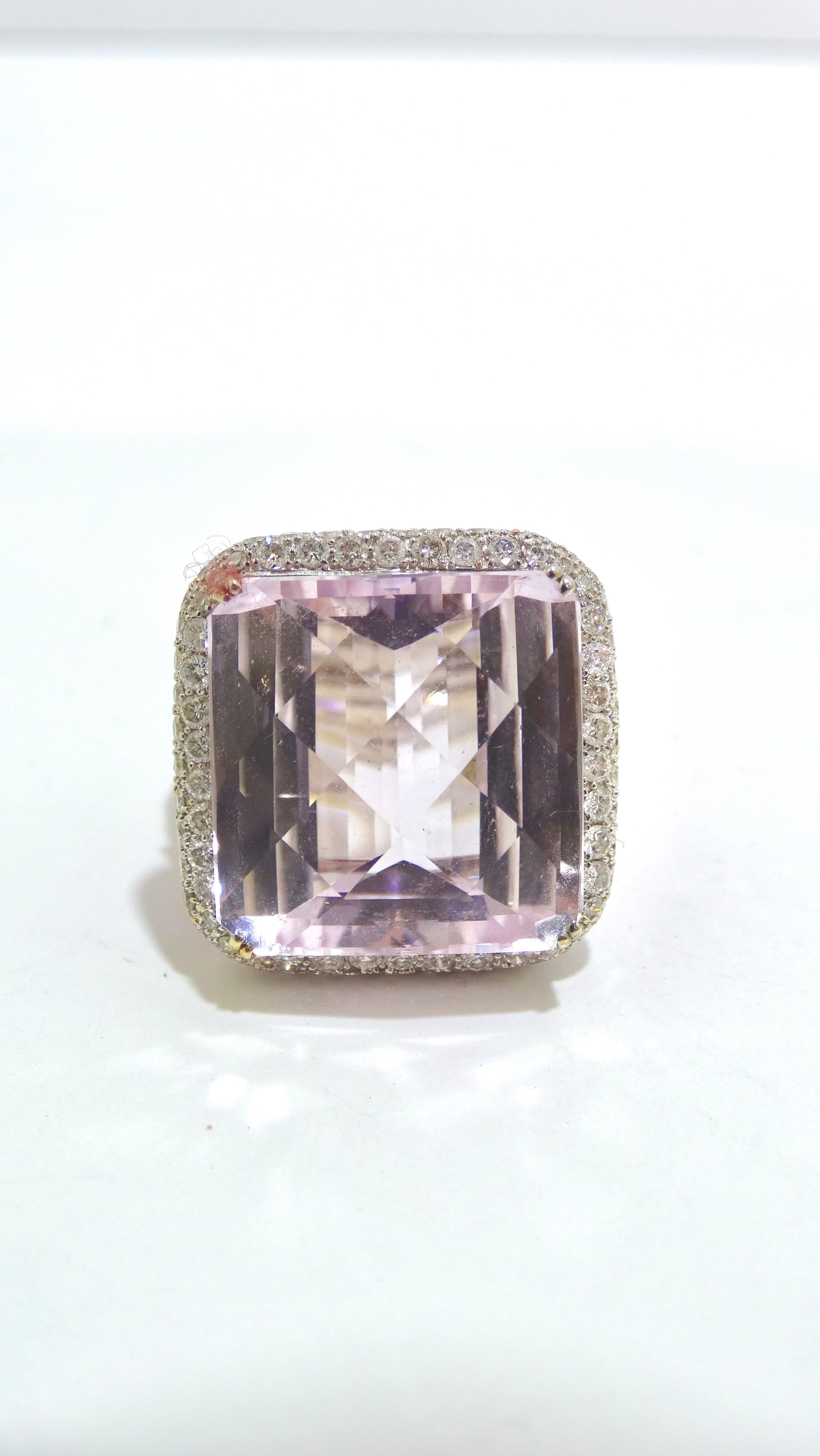 This ring is jaw-dropping. You will not feel anything short of glamorous if you add this ring to your collection. A huge and magnificent special-cut 25ct Kunzite stone is placed in the centre along with 
1.6 ct diamonds surrounding the stone and