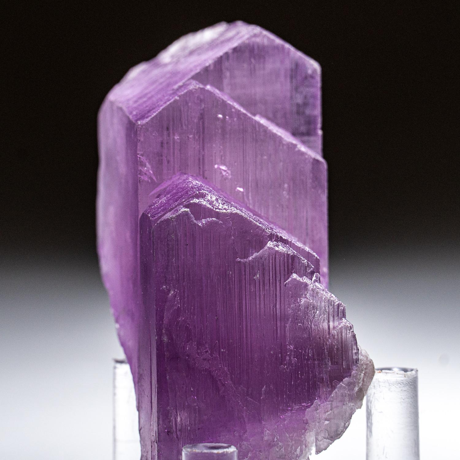 Single transparent doubly-terminated gem-grade kunzite crystal with striated prism faces and complex terminations composed of many smaller parallel faces. 

Kunzite is a beautiful crystal, pure in energy and joyful in nature. In palest pink to