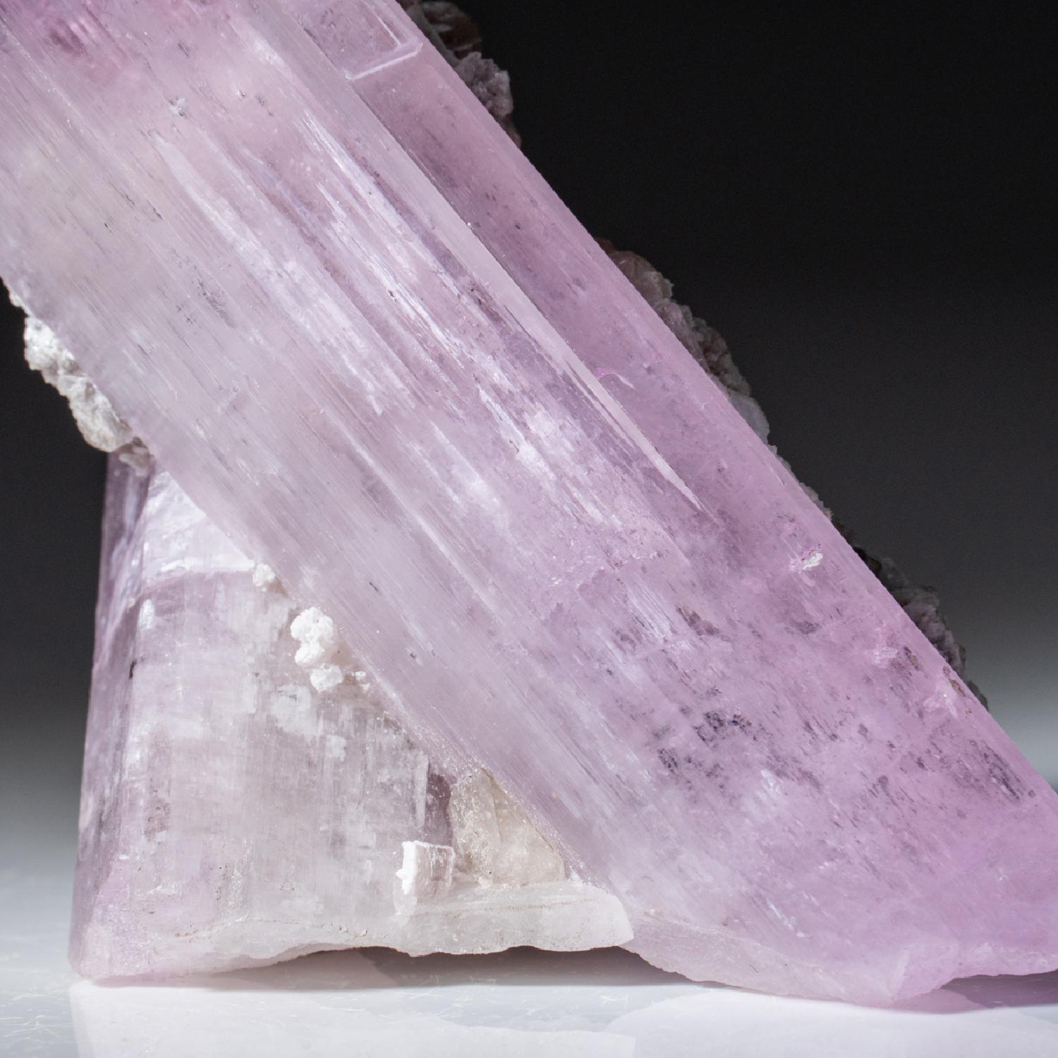 Fully terminated single crystal of transparent gem quality spodumene var. Kunzite. The crystal faces are composed of smaller lustrous parallel crystal faces.

Kunzite is a beautiful crystal, pure in energy and joyful in nature. In palest pink to