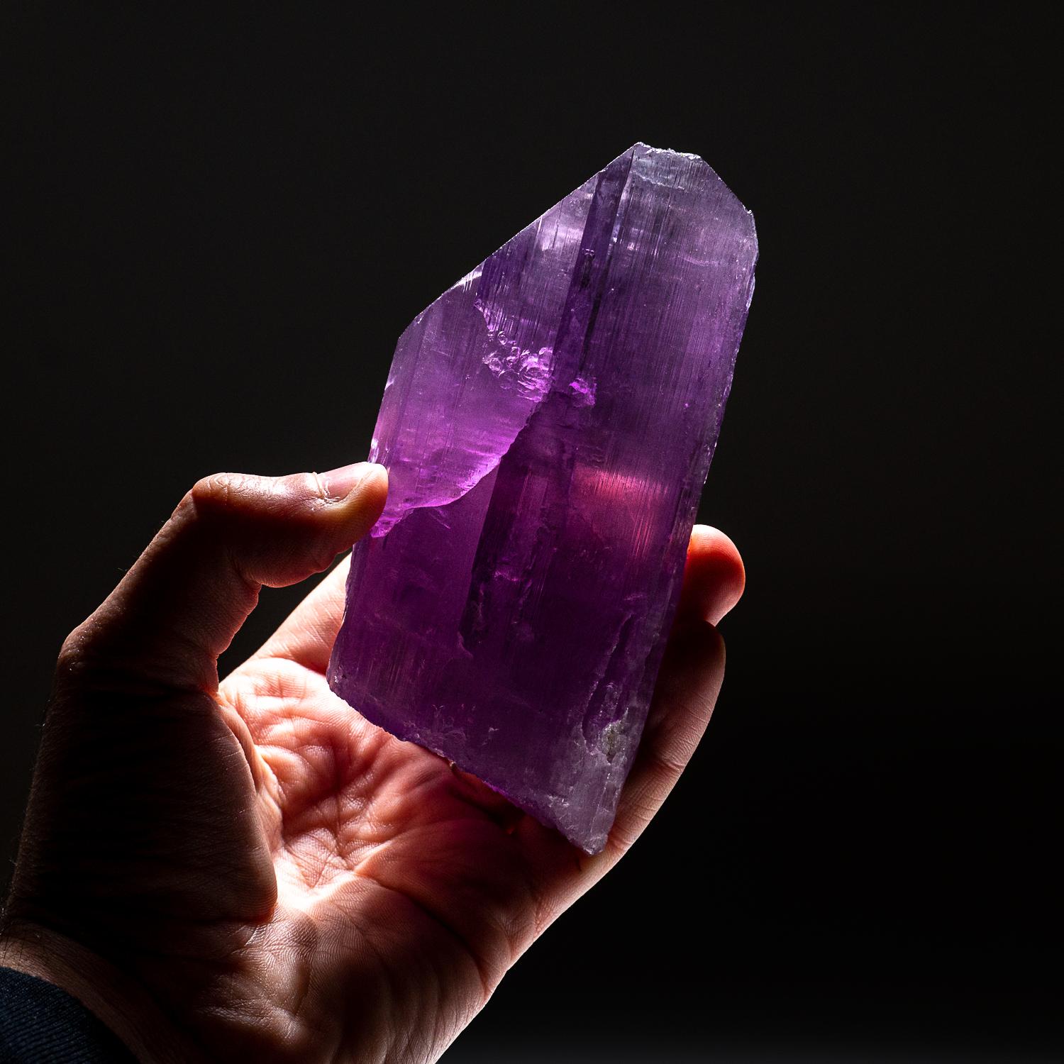 Large single crystal of transparent, pink spodumene Kunzite with striated prism faces and chisel-shaped termination.

Kunzite is a beautiful crystal, pure in energy and joyful in nature. In palest pink to light violet hues, it is a Stone of Emotion,