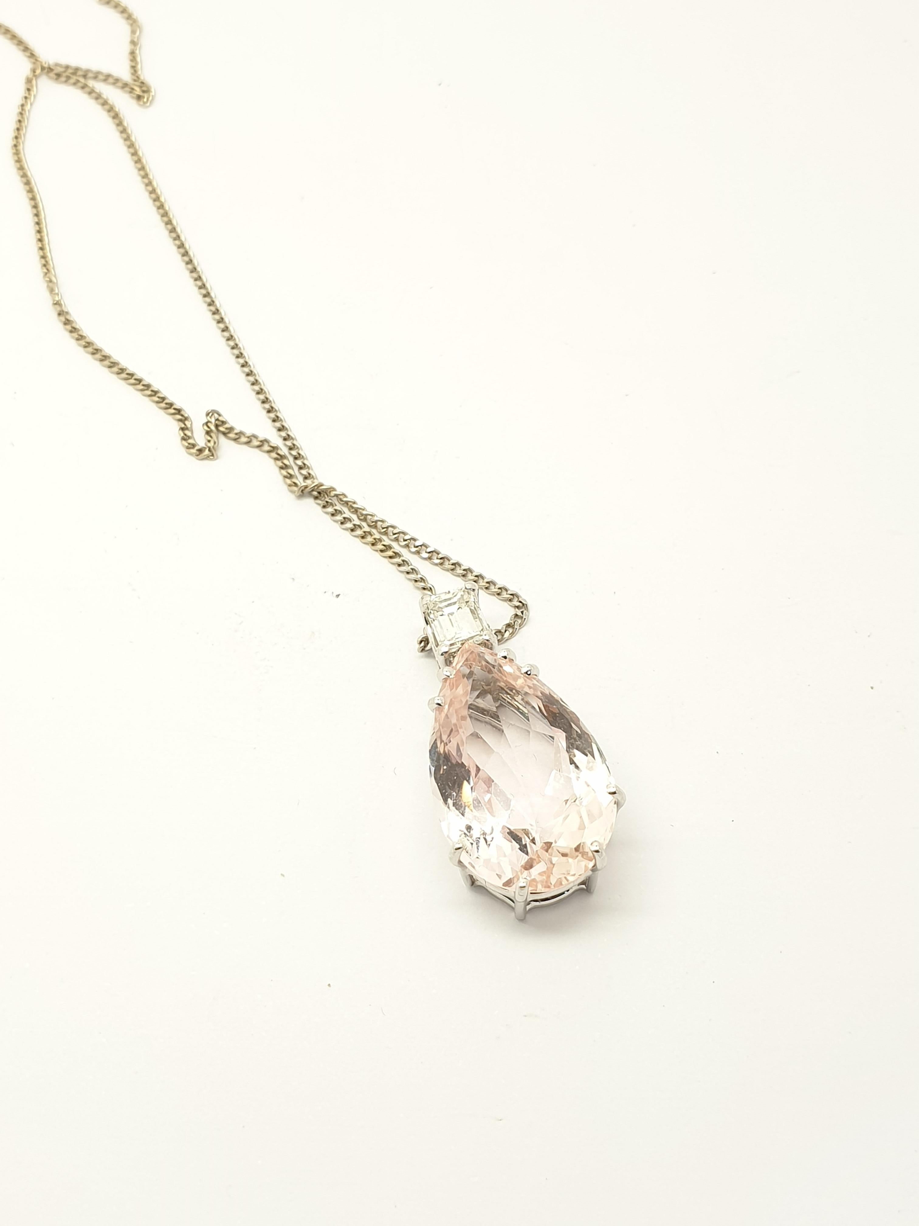 Offering a modern kunzite  diamond  necklace. The icy pink kunzite is tear drop shape set into 18kt white gold. It is 20 mm (length) 0.20ct emerald cut diamond set  on the top of the stone.The fine 18 k white gold chain is  perfect match with the