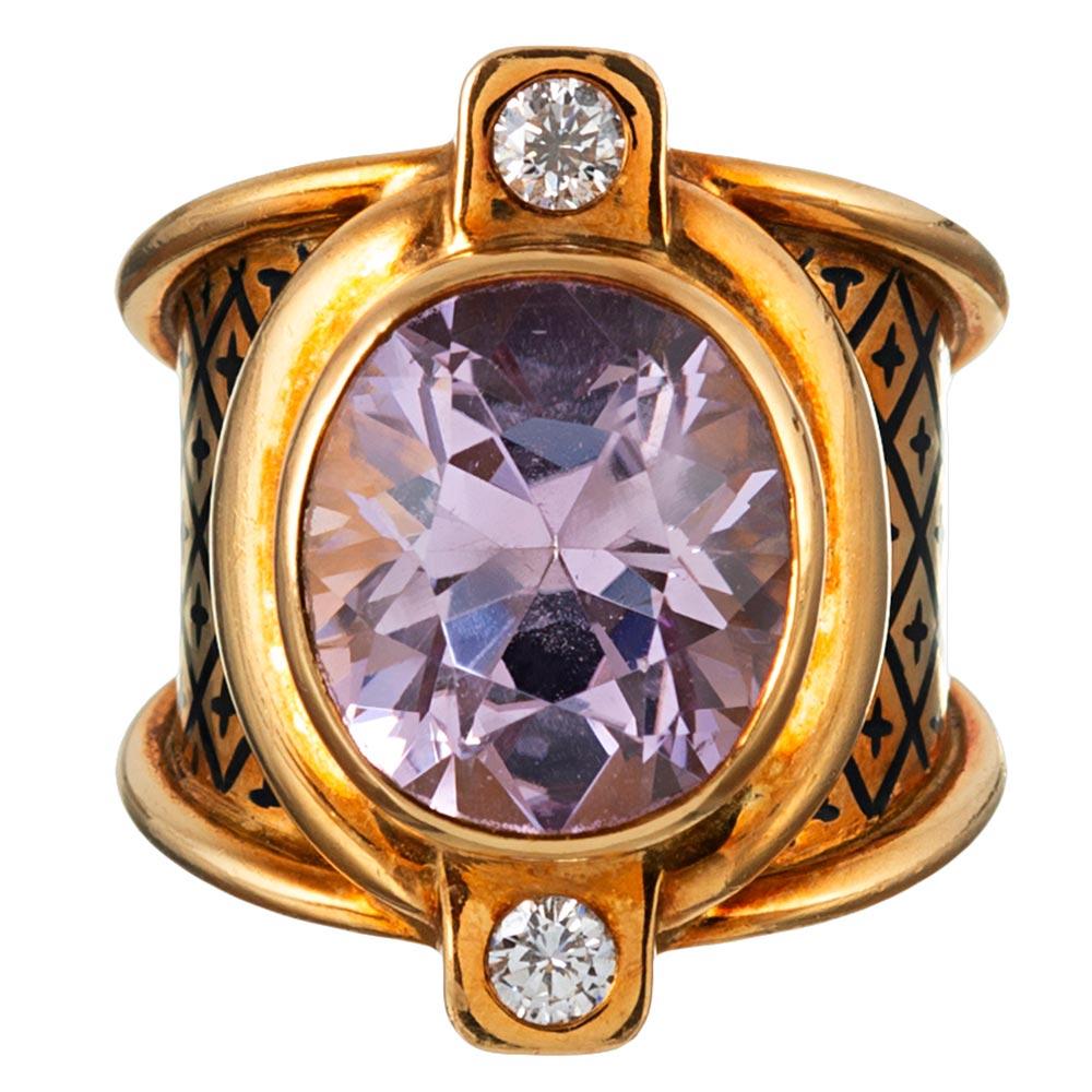 Polished strokes of 18 karat gold bathe the center 10 carat kunzite in golden light, while brilliant diamonds (.22 carats in total) are set in square stations at the North and South compass points. This uniquely stylized ring boasts bold
