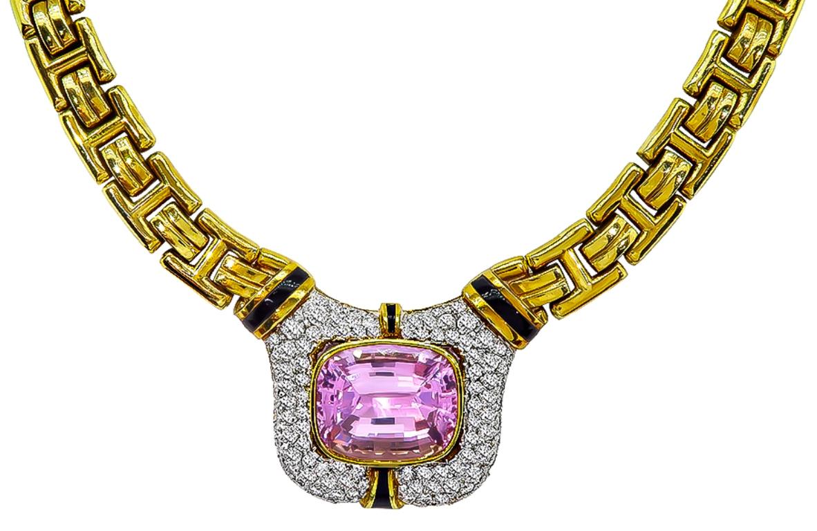 This fabulous 18k yellow and white gold necklace is set with a lovely cushion cut kunzite that weighs approximately 30.00ct. The kunzite is accentuated by sparkling round cut diamonds that weigh approximately 7.00ct. graded G color with VS clarity.