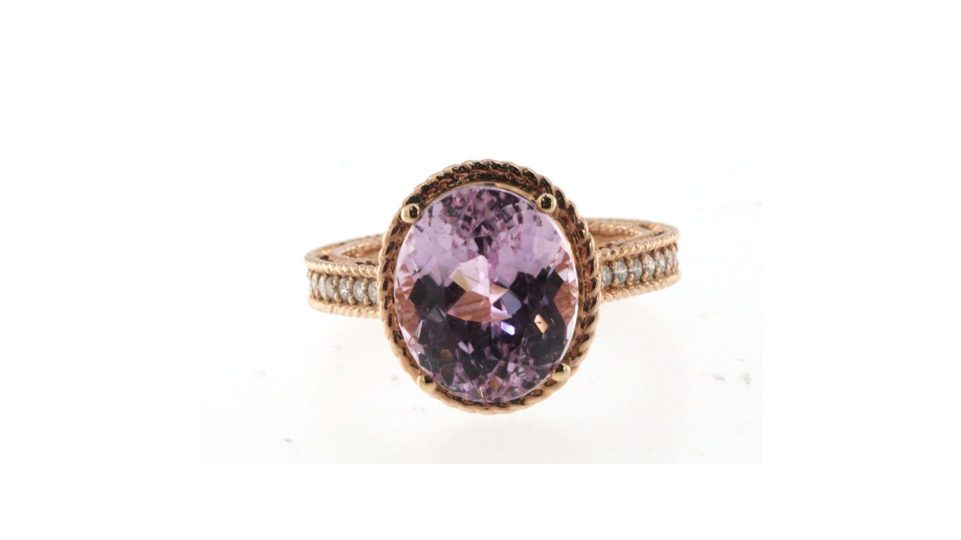 
This is a very unique Kunzite 6.4ct  ring with 14 diamonds down the band.  Its set in 14K Rose gold and really stands out 
Kunzite is the best-known variety of the mineral spodumene. It’s named after famed gemmologist George Frederick Kunz, who was