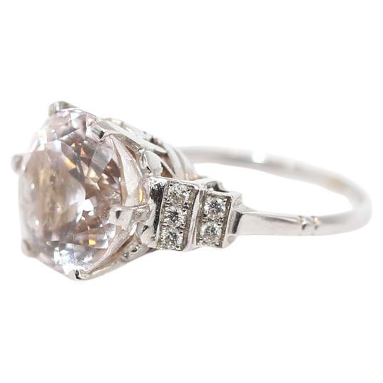 Kunzite & Diamonds ring, set in  white 18 Karats Gold. Created in the 1970es yet the design and elegance that it brings is absolutely timeless. 

18K Gold. A Kunzite diameter is 12 mm. Set by 10 fine Diamonds, five on each side in two rows.
