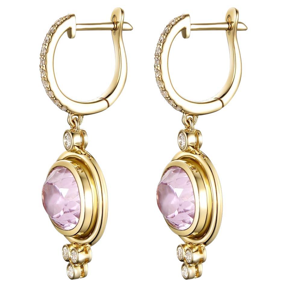 This earrings feature 2 kunzite weight 8.30 carat, assented with 0.32 carat of brilliant cut diamonds.  Earrings are set in 18 karat yellow gold.

18 Karat Yellow Gold
Kunzite 8.30 carat
Diamond 0.64 carat