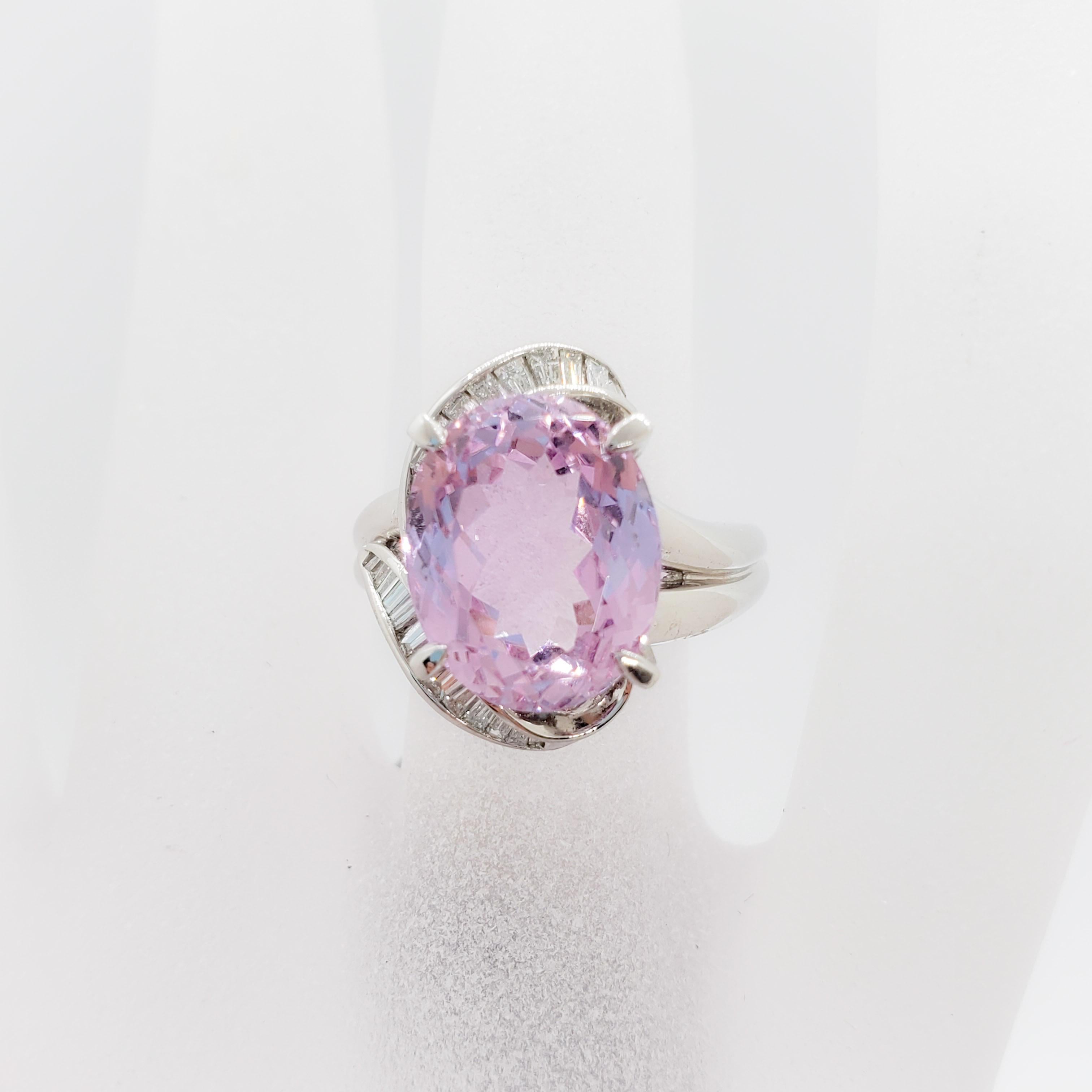 Gorgeous estate 7.70 ct. kunzite oval in a beautiful pink color with 0.43 ct. of white diamond baguettes.  Handmade platinum mounting, ring size is 6.25.  Big look for a reasonable price.  Excellent condition.