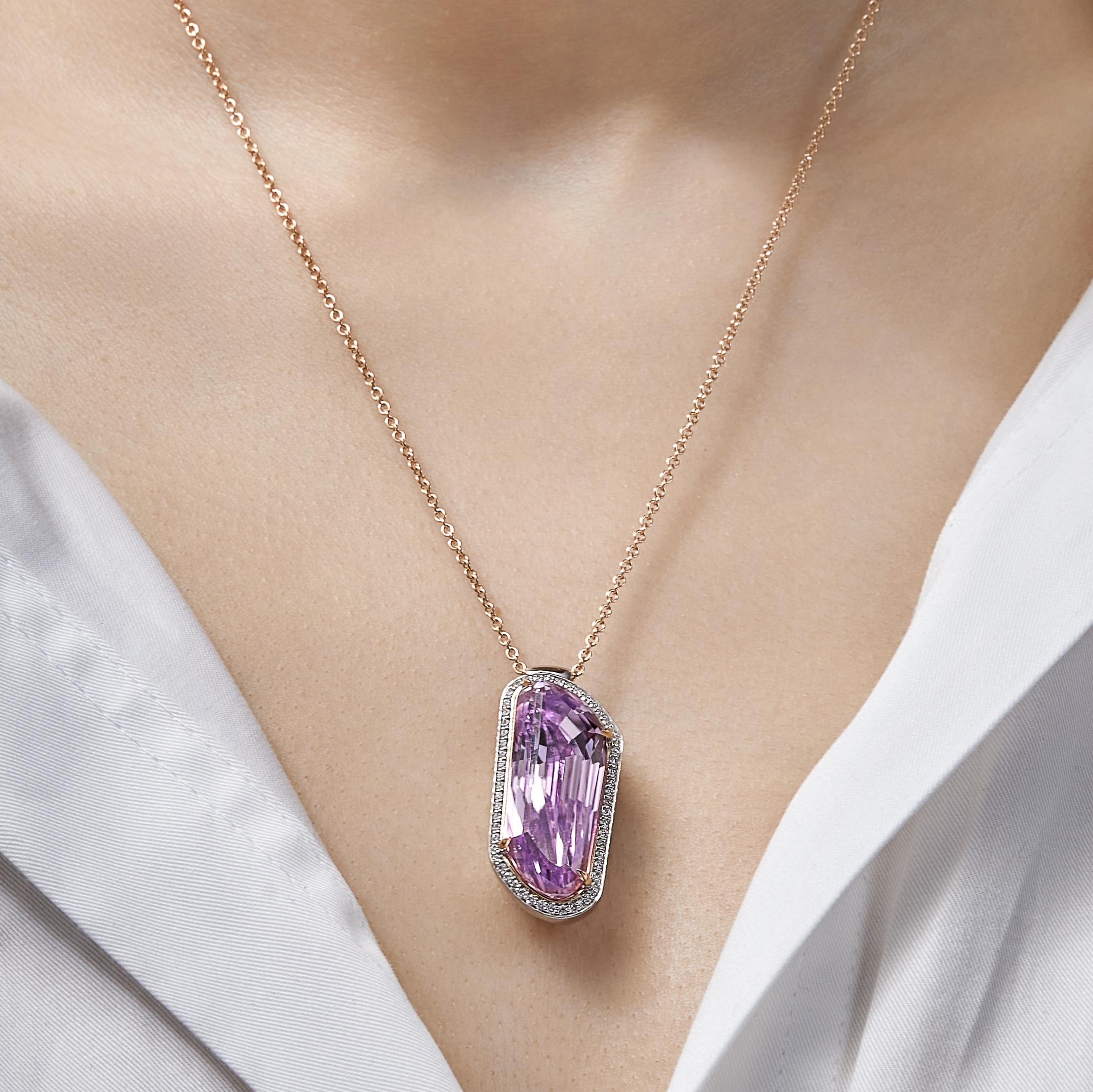 Indulge in the captivating allure of our Kunzite Pendant Necklace, a masterpiece of elegance and charm. 
Crafted with the finest materials, this necklace showcases a combination of 18-karat white gold and rose gold, ensuring durability and lasting