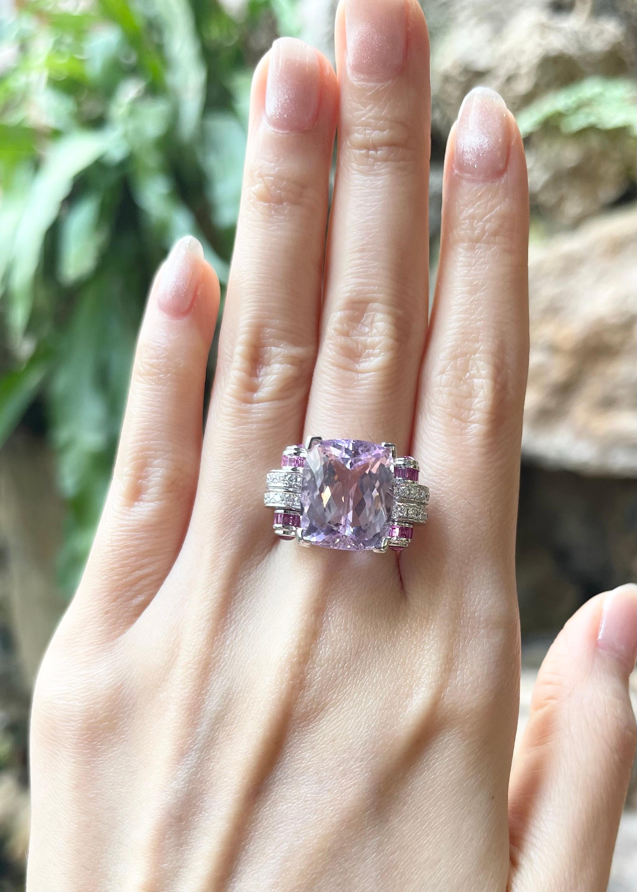 Kunzite 12.61 carats, Pink Sapphire 1.10 carats, Cabochon Pink Sapphire 0.60 carat and Diamond 0.33 carats Ring set in 18K White Gold Settings

Width:  2.3 cm 
Length: 1.5 cm
Ring Size: 53
Total Weight: 14.41 grams

