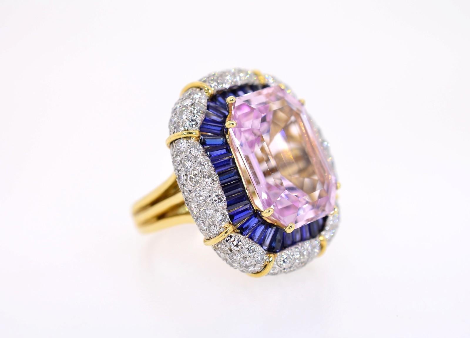 A ring with enough bling to catch an admirer's attention. Created in 18KT yellow gold flaunting a lively cut-cornered, emerald cut Kunzite weighing approx. 16.00 carat. The lovely stone is surrounded by luminous calibrated baguette cut Ceylon