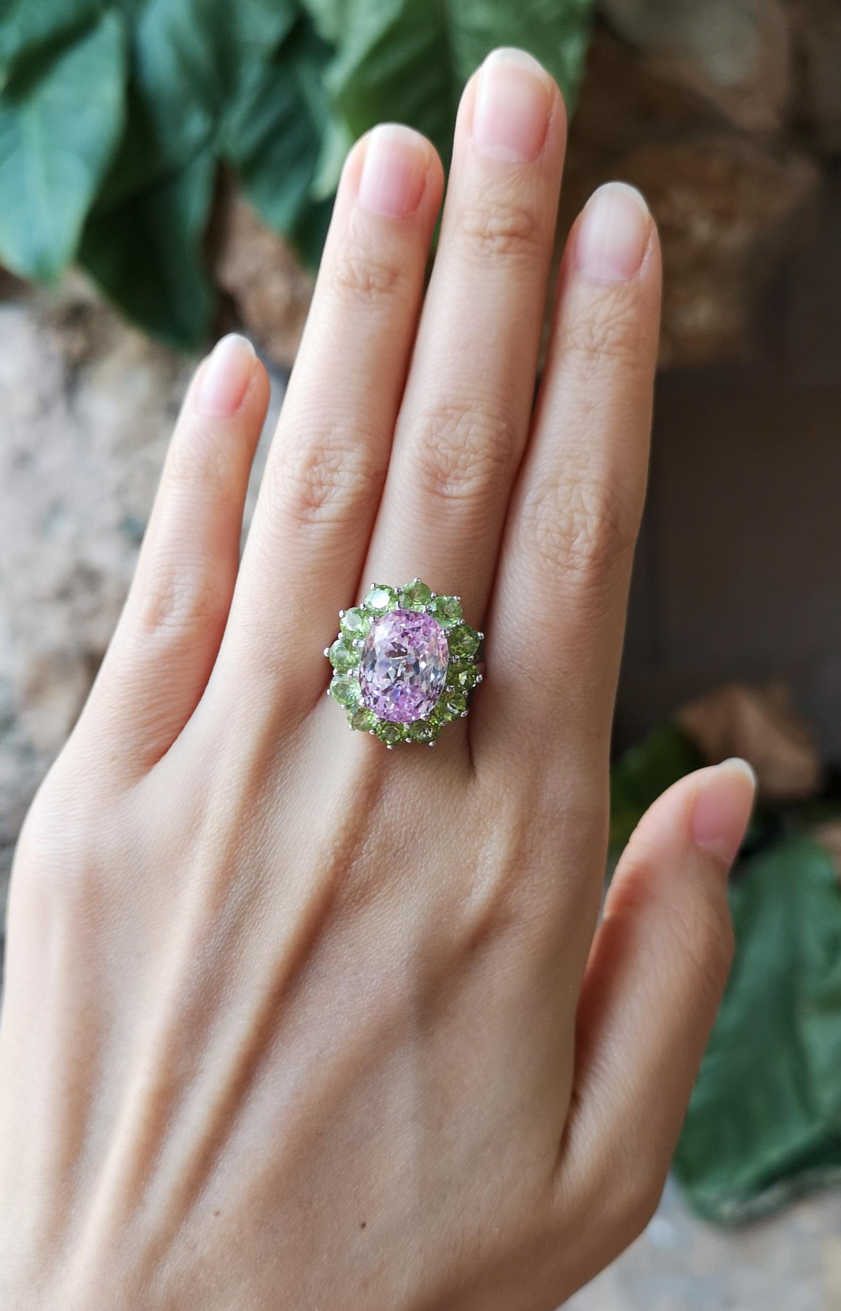 Kunzite 8.80 carats with Peridot 3.40 carats Ring set in 18 Karat White Gold Settings

Width:  1.7 cm 
Length: 2.1  cm
Ring Size: 54
Total Weight: 11.23 grams



