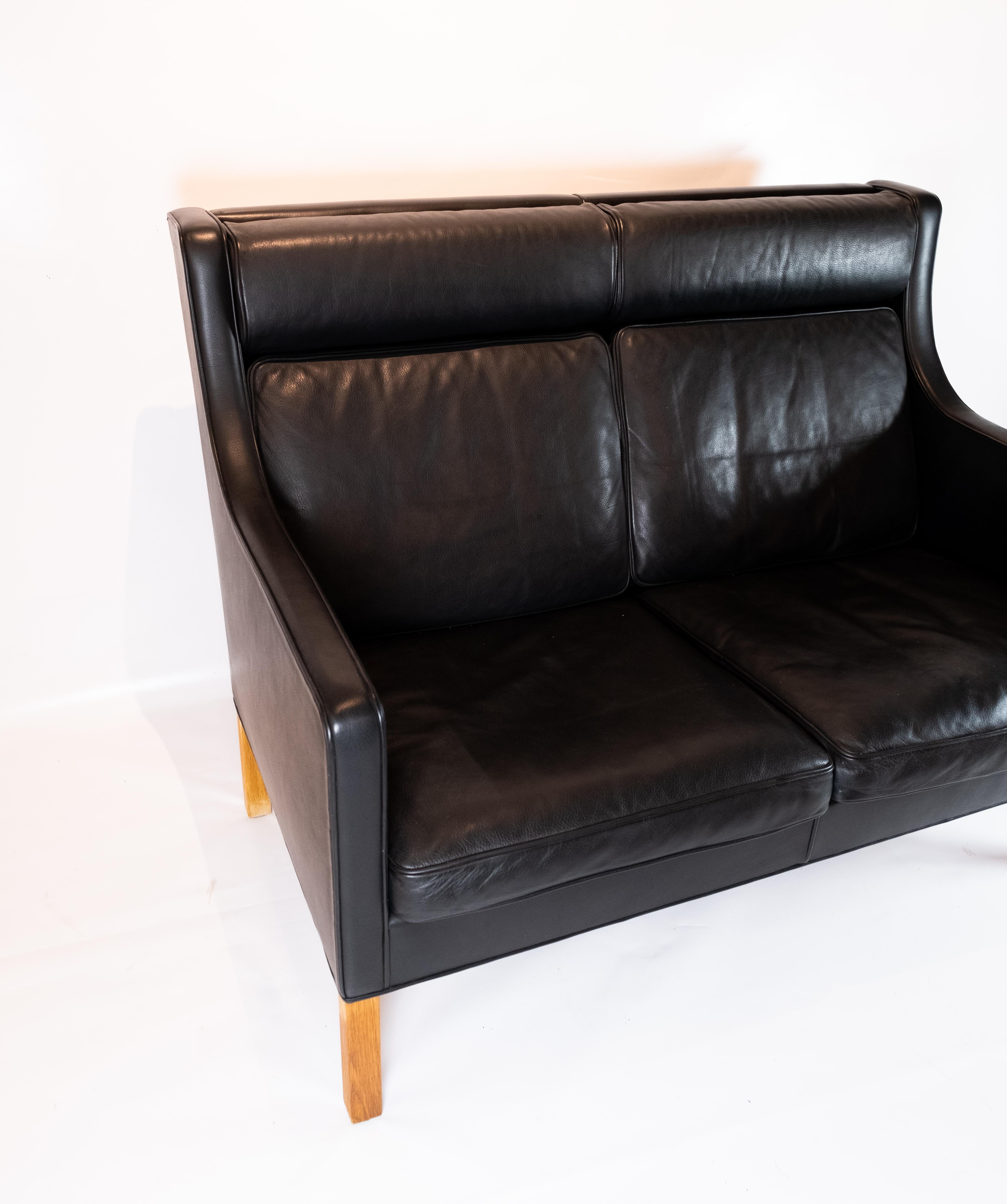 Kupe 2-seat sofa, model 2192, designed by Børge Mogensen in 1971 and manufactured by Fredericia Furniture. The sofa is upholstered with black leather and is in great vintage condition.
  