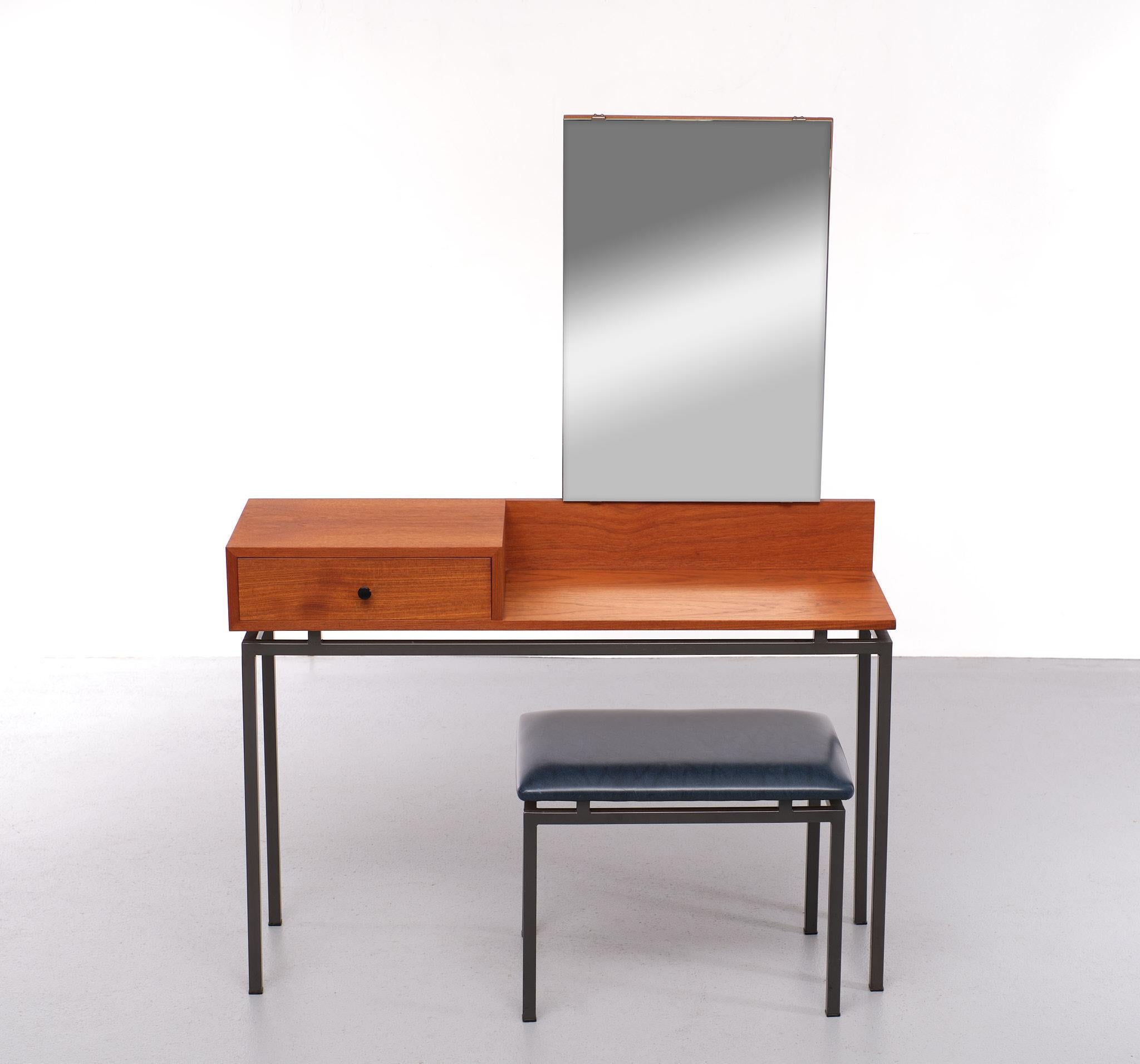 Very nice sleek vanity. Made in Holland in the 1950s by Kuperes The company still exists 
Teak wood on a square Grey metal base, comes with the matching stool 
