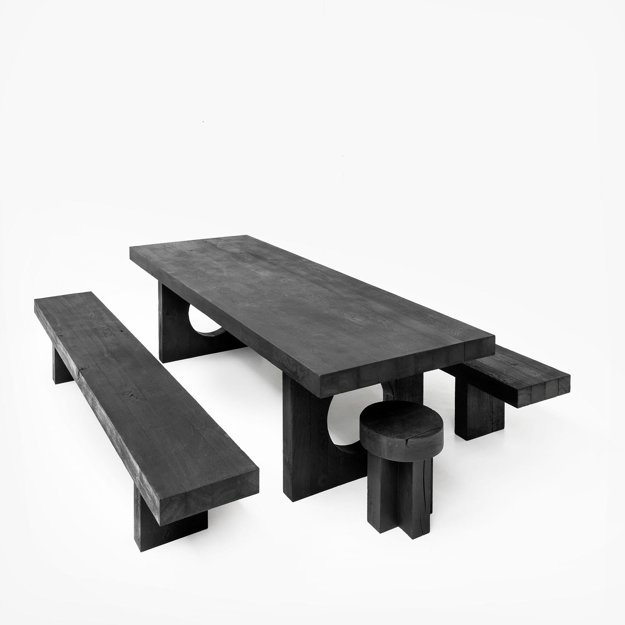 The Kurai Collection consists of a solid oak dining table, two benches and two stools finished with the Shou Sugi Ban technique.
Burning the wood creates an intense black color and at the same time protects it against wind and weather.
This old