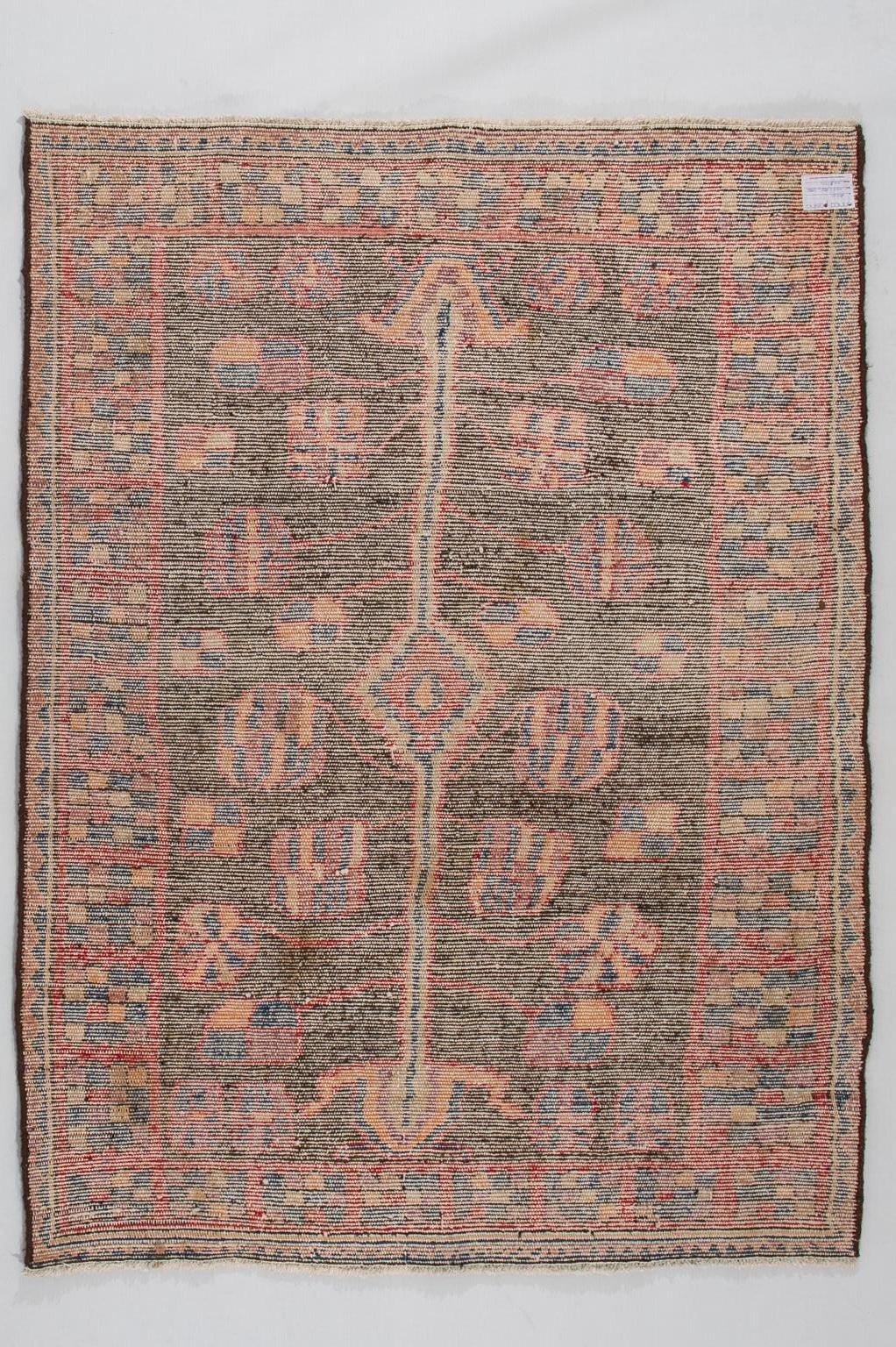 Carpet of naive production, woven in some village in the mountains of Kurdestan: represents a pomegranate tree, symbol of good auspicious.