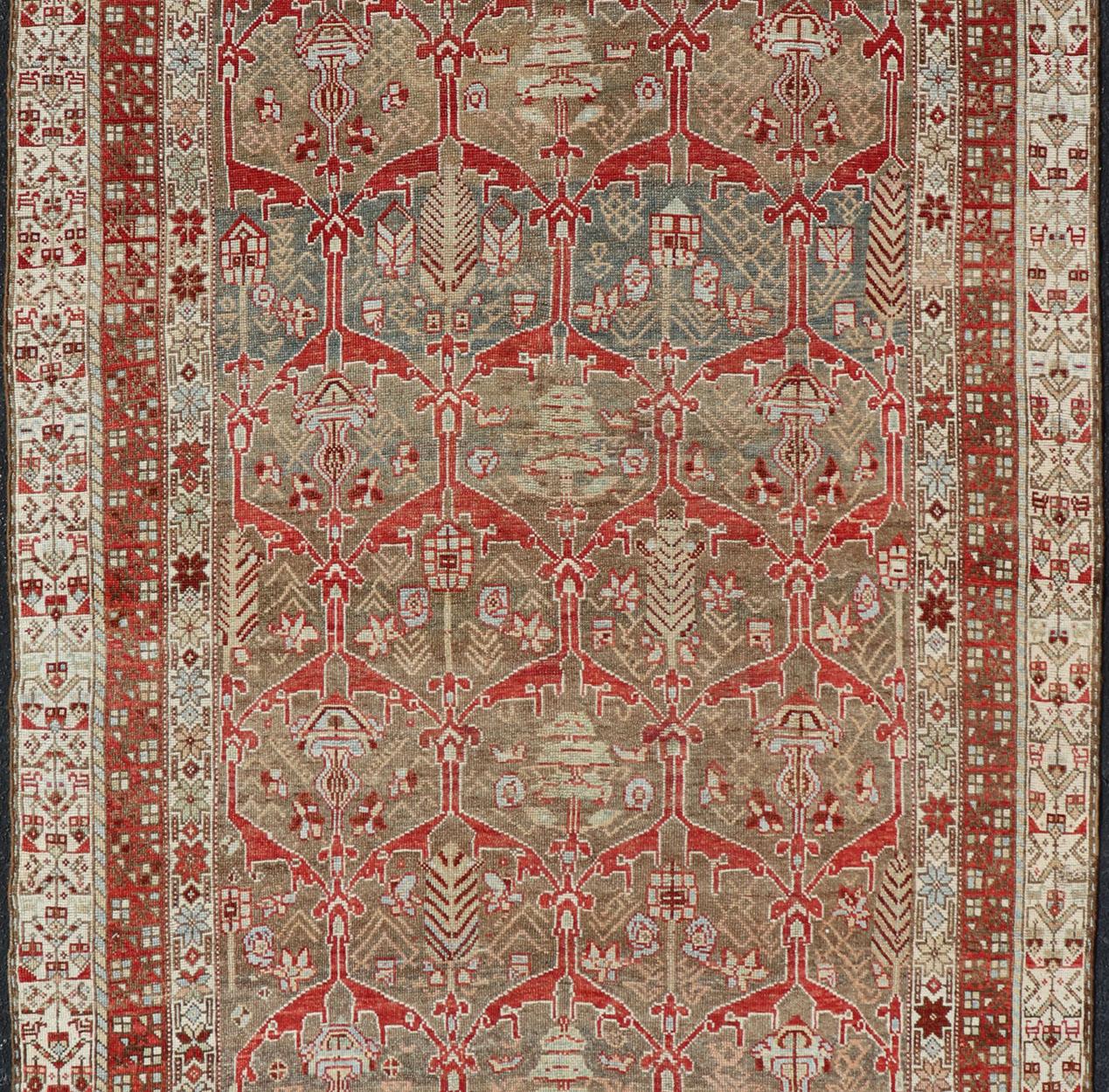 Persian Kurdish Antique Gallery Runner with Tribal Design in Light Green, Tan and Red For Sale