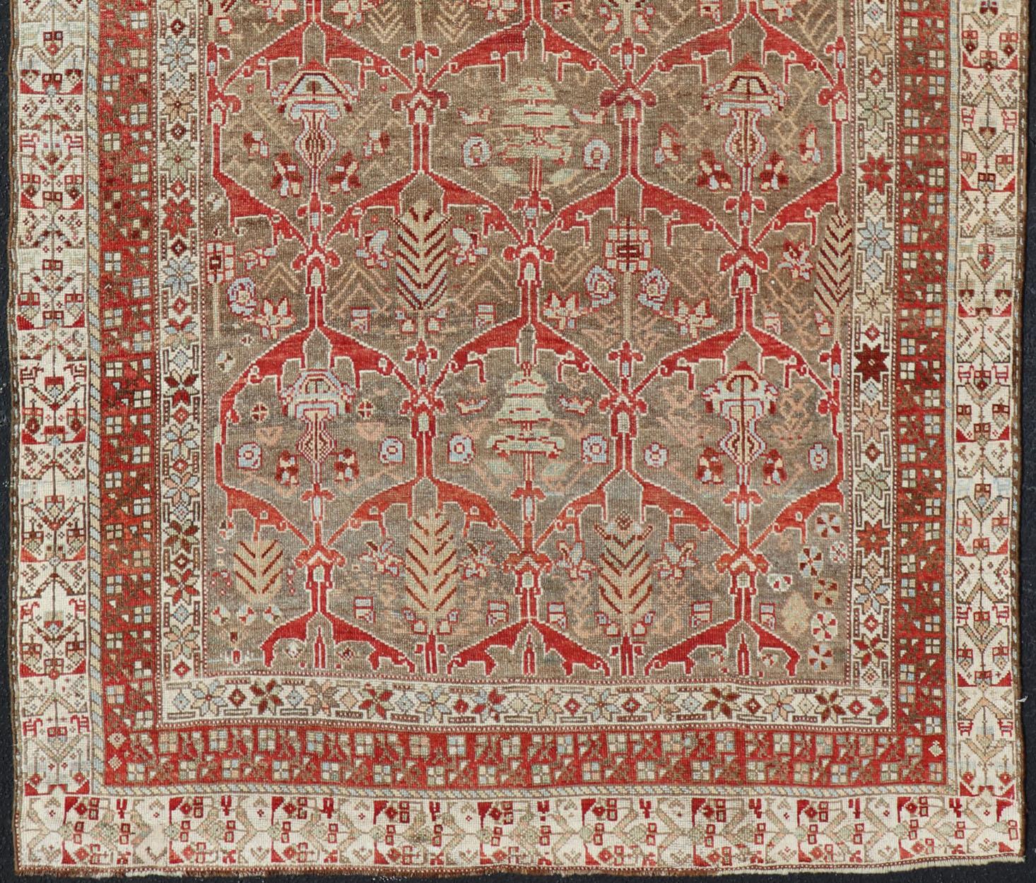 Hand-Knotted Kurdish Antique Gallery Runner with Tribal Design in Light Green, Tan and Red For Sale
