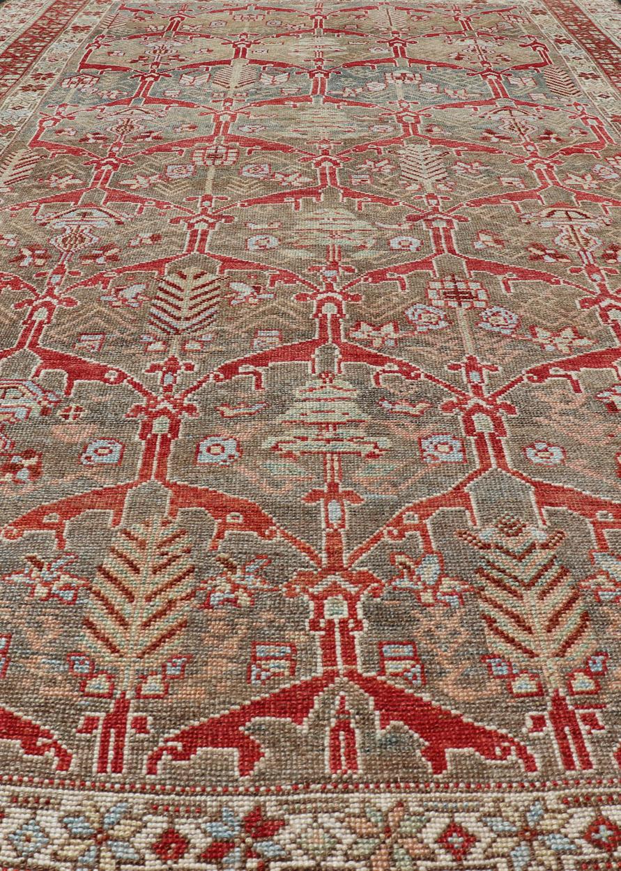 Kurdish Antique Gallery Runner with Tribal Design in Light Green, Tan and Red In Good Condition For Sale In Atlanta, GA