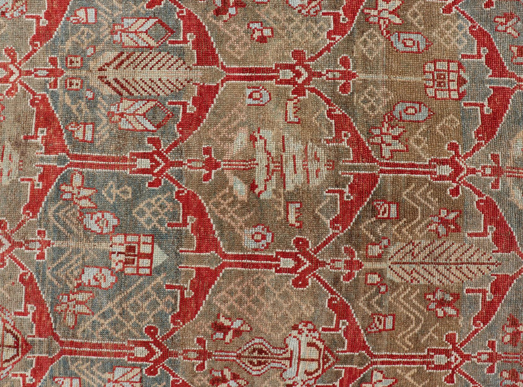 Wool Kurdish Antique Gallery Runner with Tribal Design in Light Green, Tan and Red For Sale