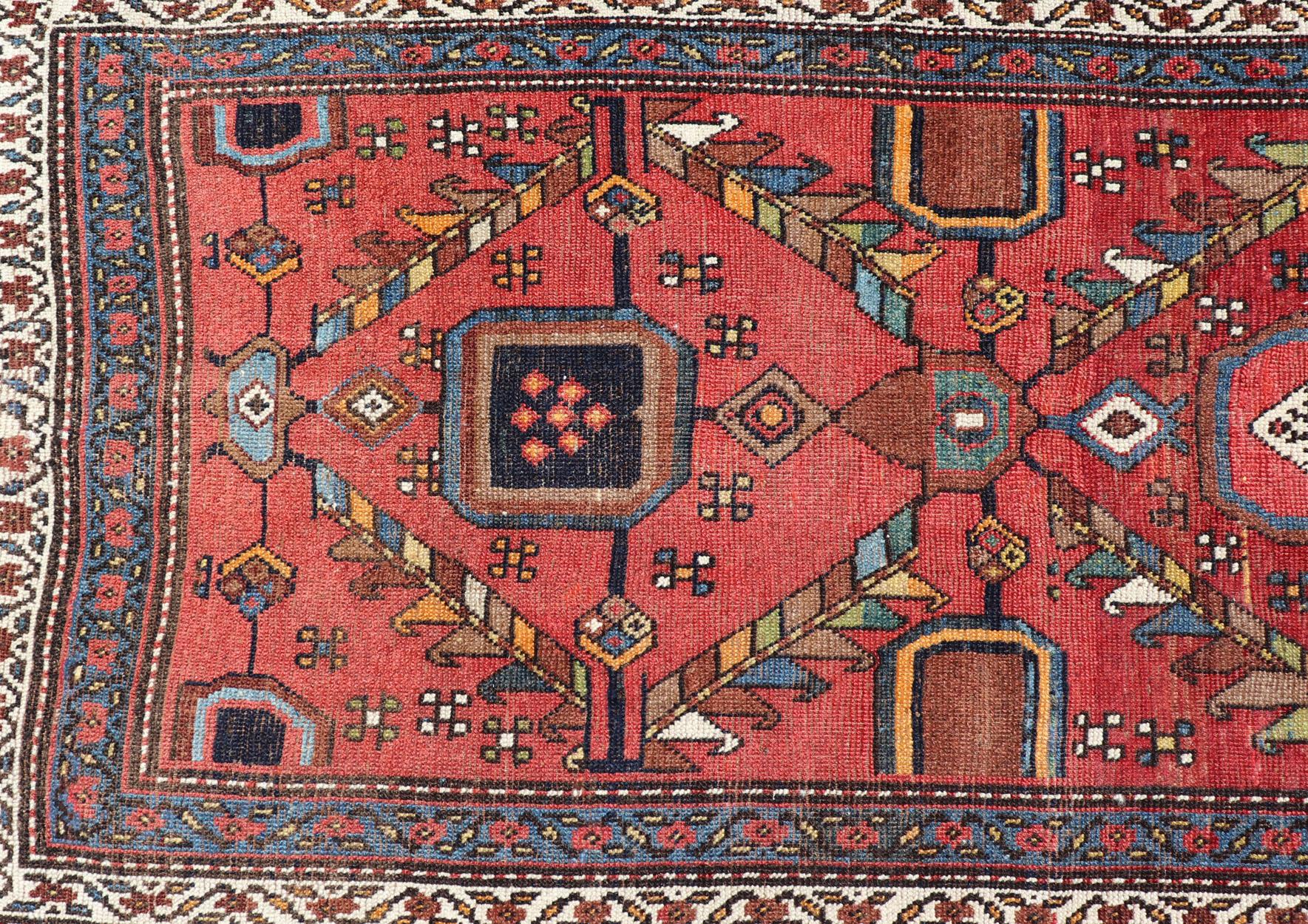 Persian Kurdish Antique Runner in Vibrant Red Background and Multi-tiered Border For Sale