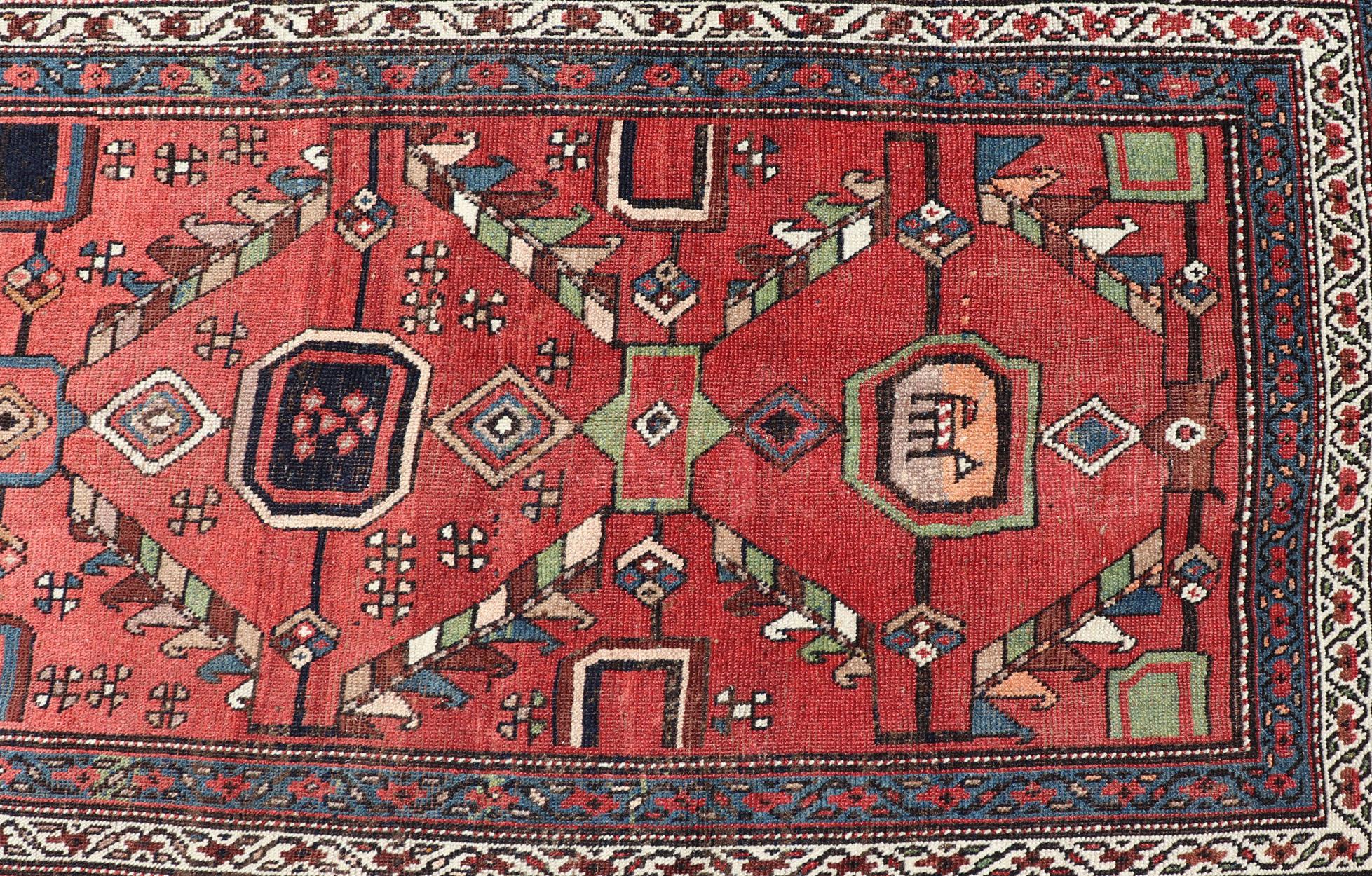 20th Century Kurdish Antique Runner in Vibrant Red Background and Multi-tiered Border For Sale