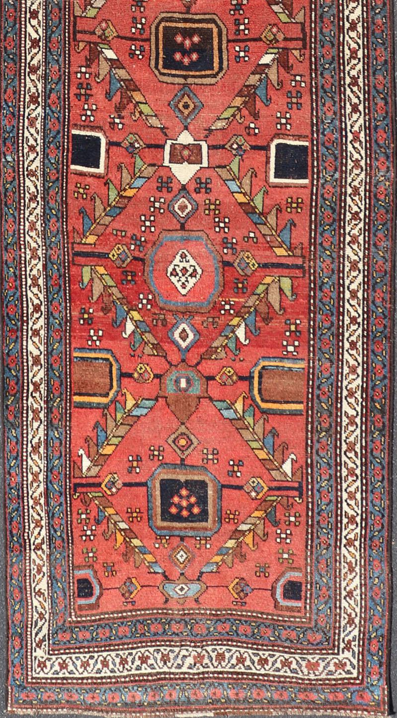Kurdish Antique Runner in Vibrant Red Background and Multi-tiered Border For Sale 1