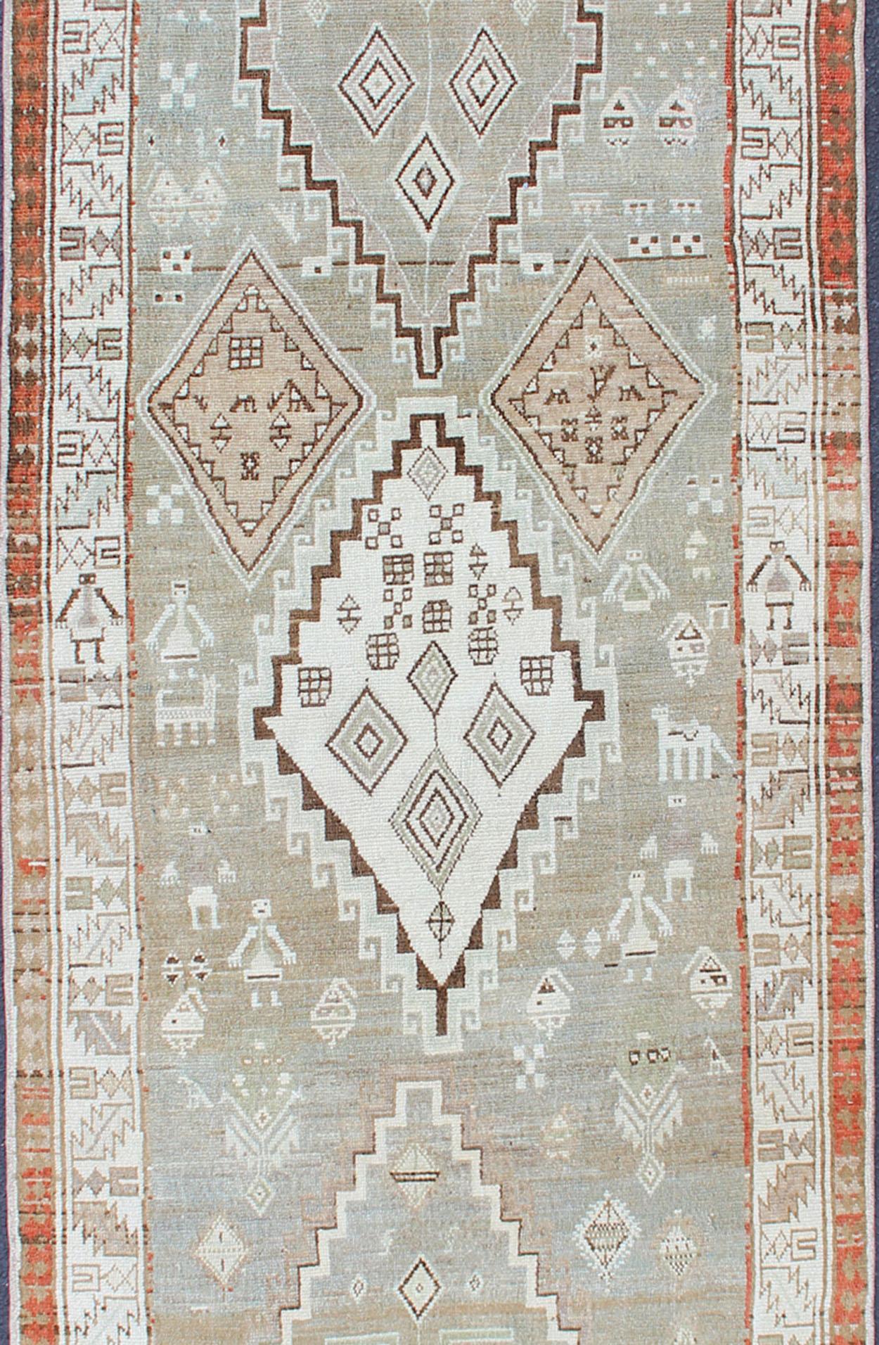 Hand-Knotted Kurdish Antique Runner with Tribal Design in Light Green, Taupe & Orange-Red For Sale