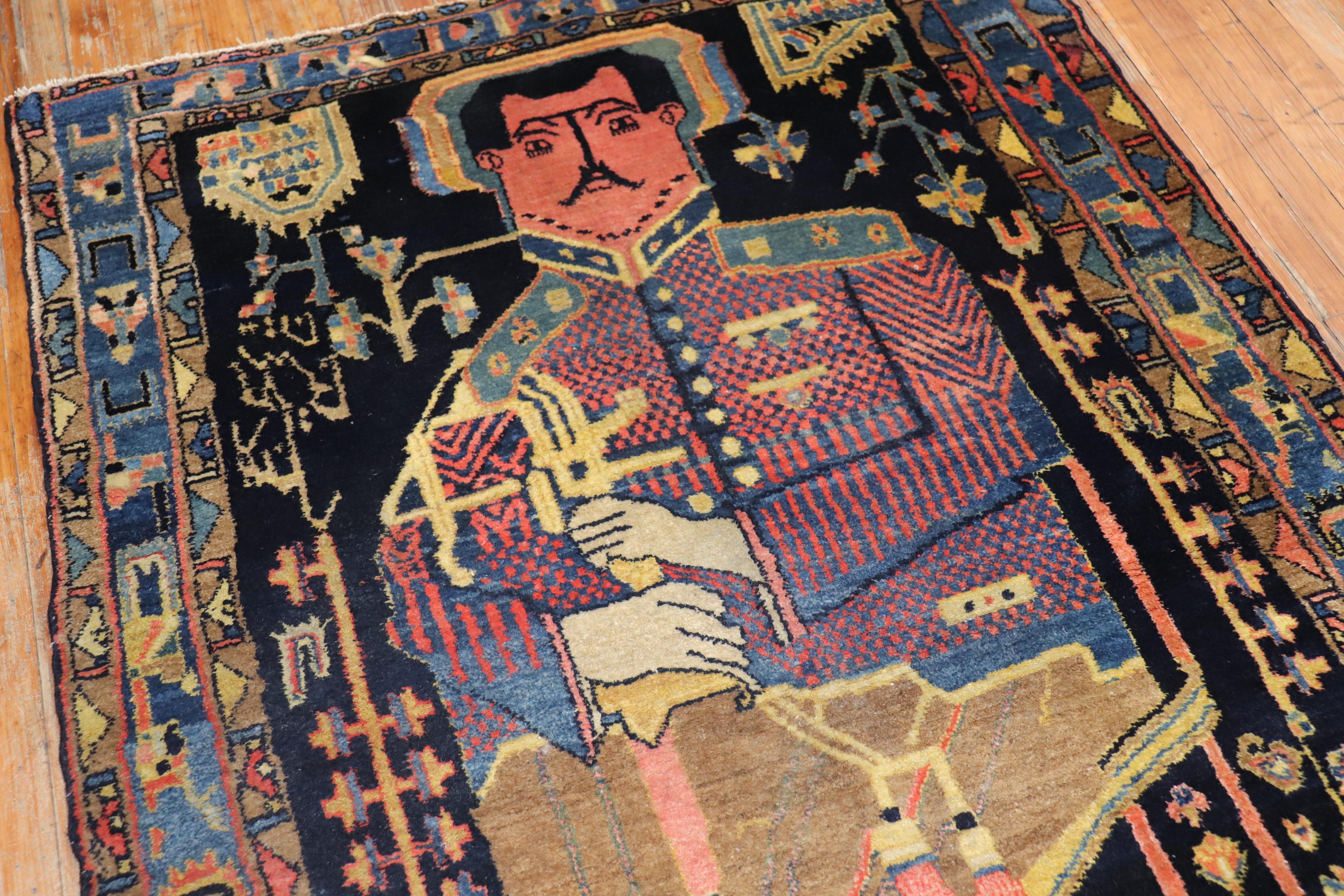 A mid-20th century Persian Kurd rug depicting a Colonel Mohammad Taqi-Khan Pessian (1892-3 October 1921), also spelled as Pesyan and Pesseyan, who was an Iranian gendarme and pilot who formed and lead the short-lived Autonomous Government of