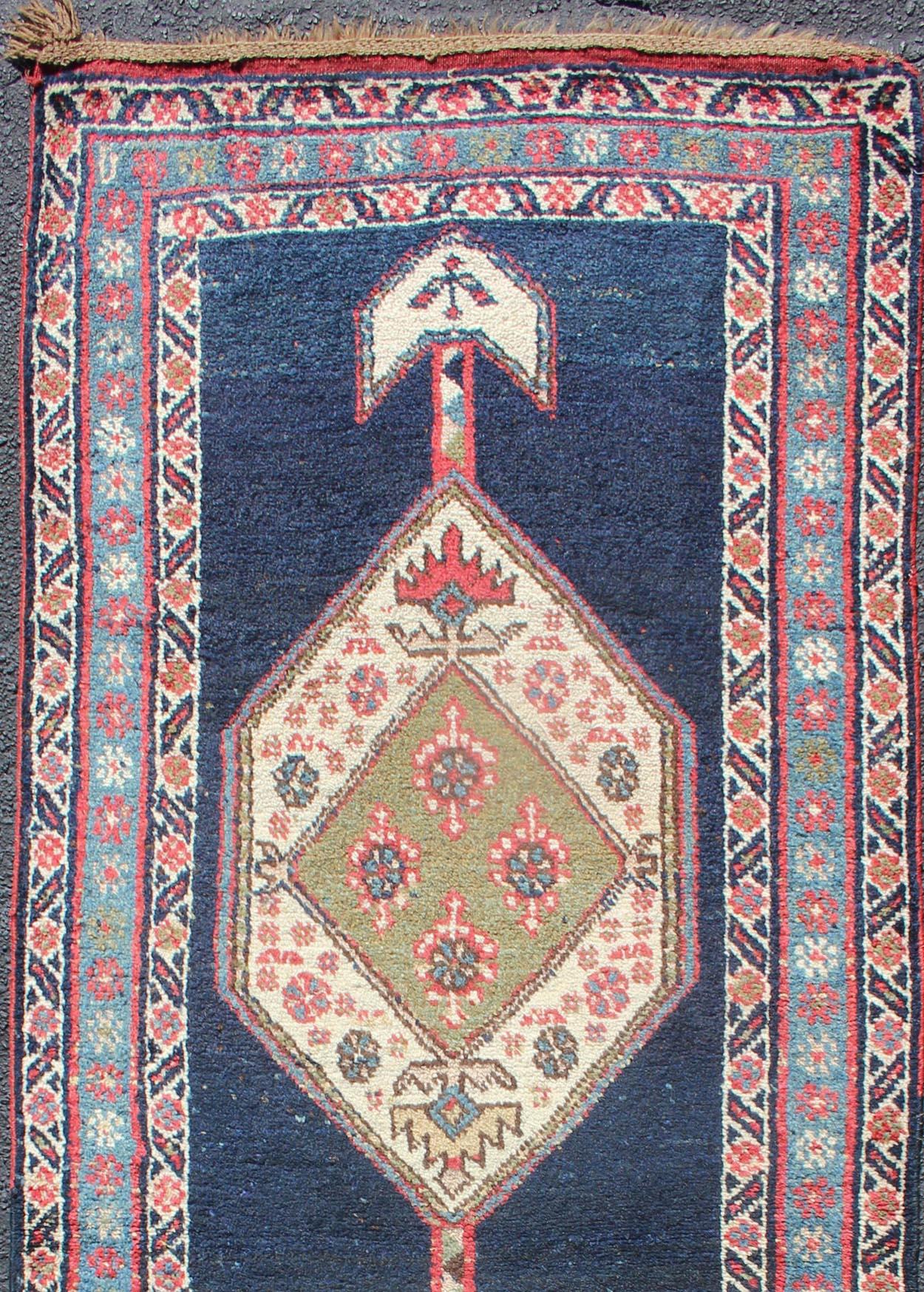 Double-pointed arrow design antique Persian Kurdish runner in Blue and light red , rug PR-M519, country of origin / type: Iran / Kurdish, circa 1900

This Kurdish tribal rug was woven by Kurdish weavers in western Persia. Often they used this