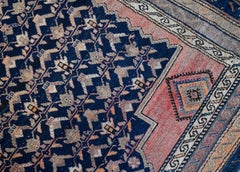 Kurdish Wool Rug with Pale Pink, Apricot, Ivory and Indigo Accents c.1910