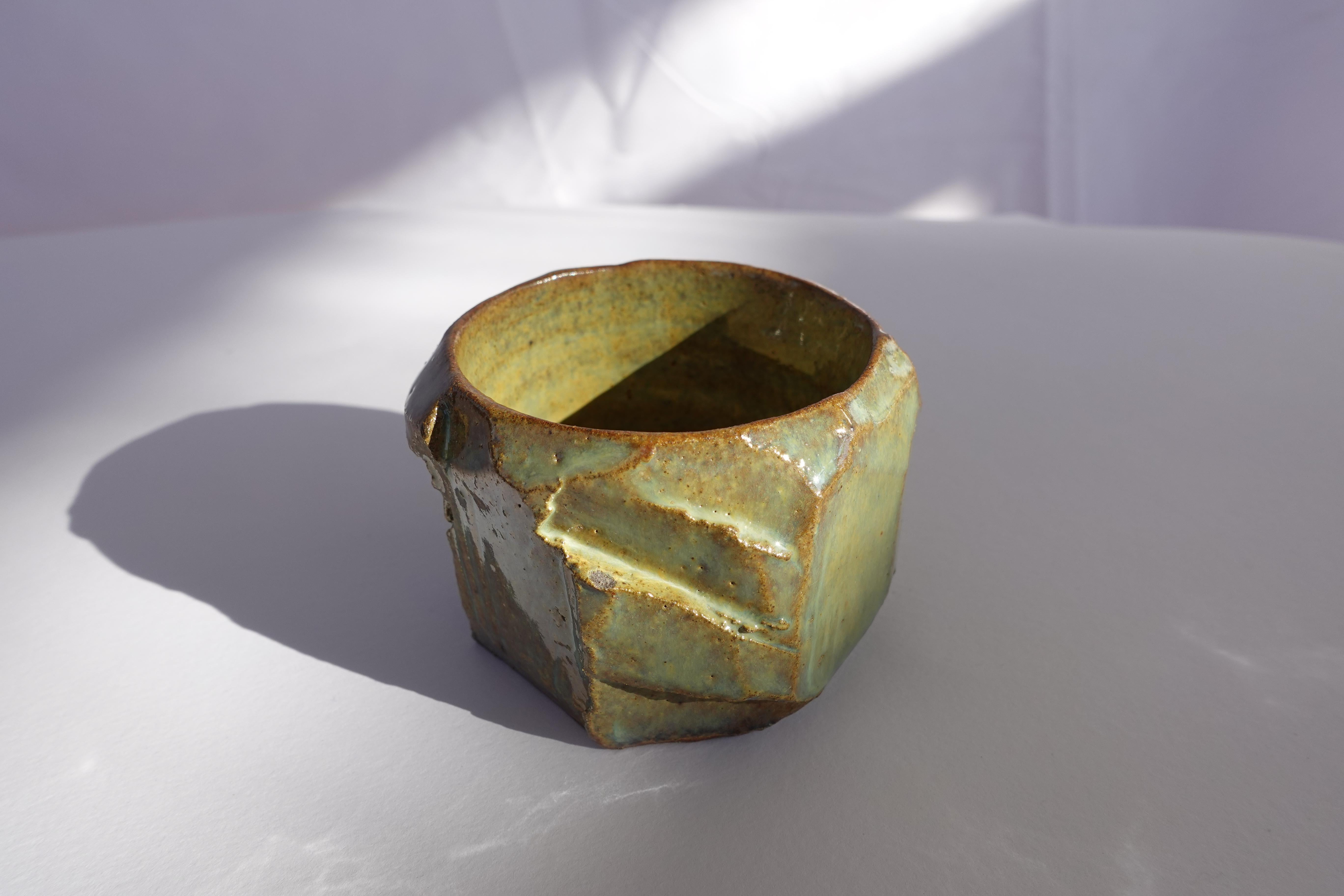 This espresso cup was first wheel-thrown and then meticulously carved by hand using the traditional kurinuki technique, allowing the form to emerge intuitively from the clay. Each angle, ridge, and textured surface reveals a moment of exploration