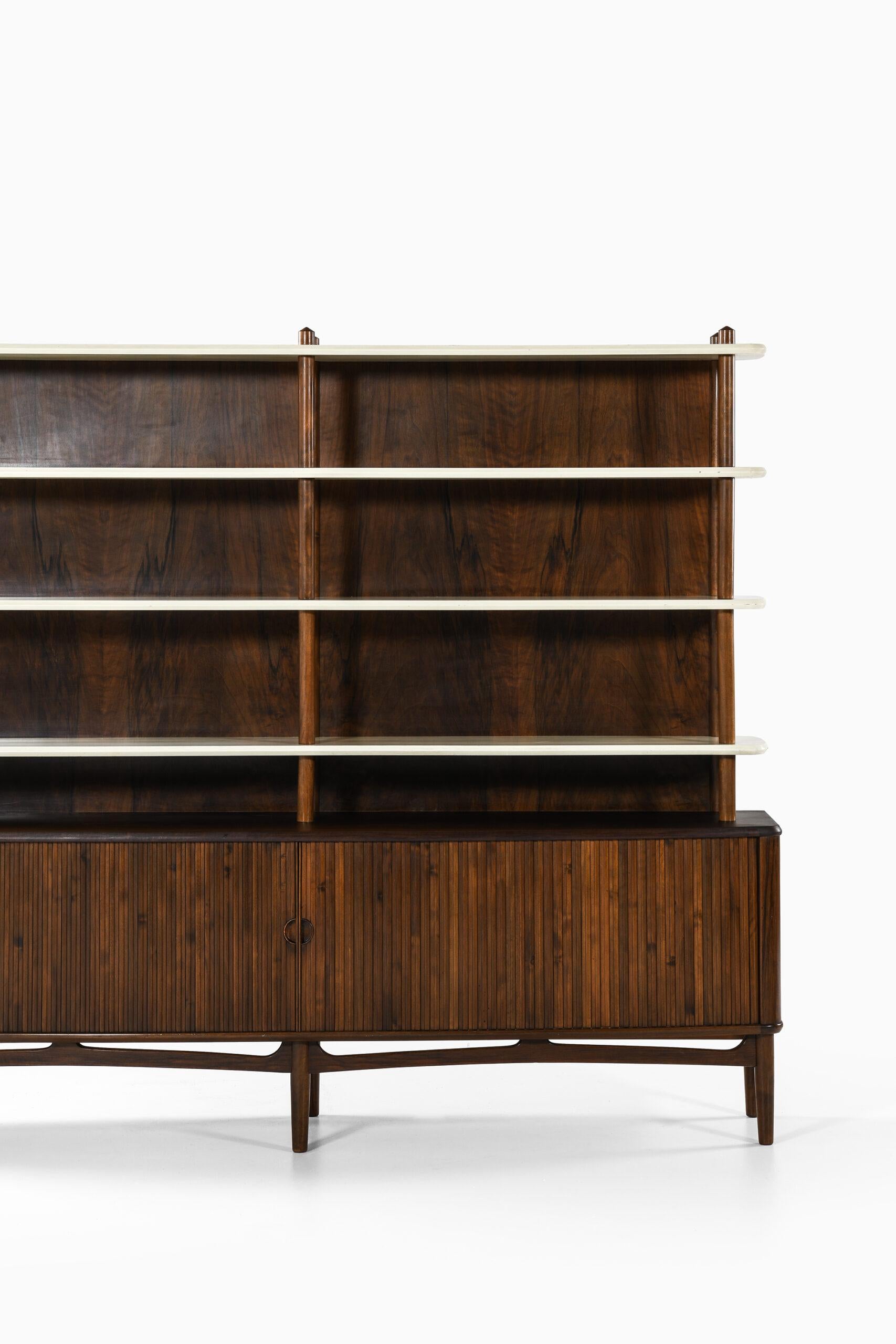 Rare bookcase designed by Kurt Olsen. Produced by A. Andersen & Bohm in Denmark.