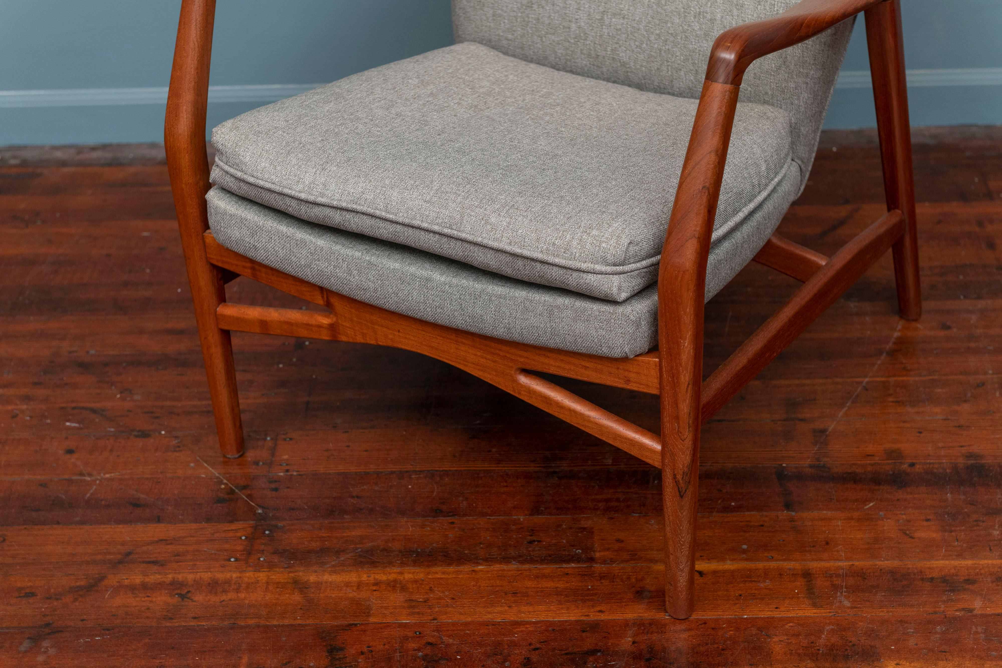 Kurt Olsen design teak lounge chair model 215 for Slagelse, Denmark. Newly refinished and upholstered in a light gray wool, very comfy chair with a small foot print. Ready to install and enjoy.