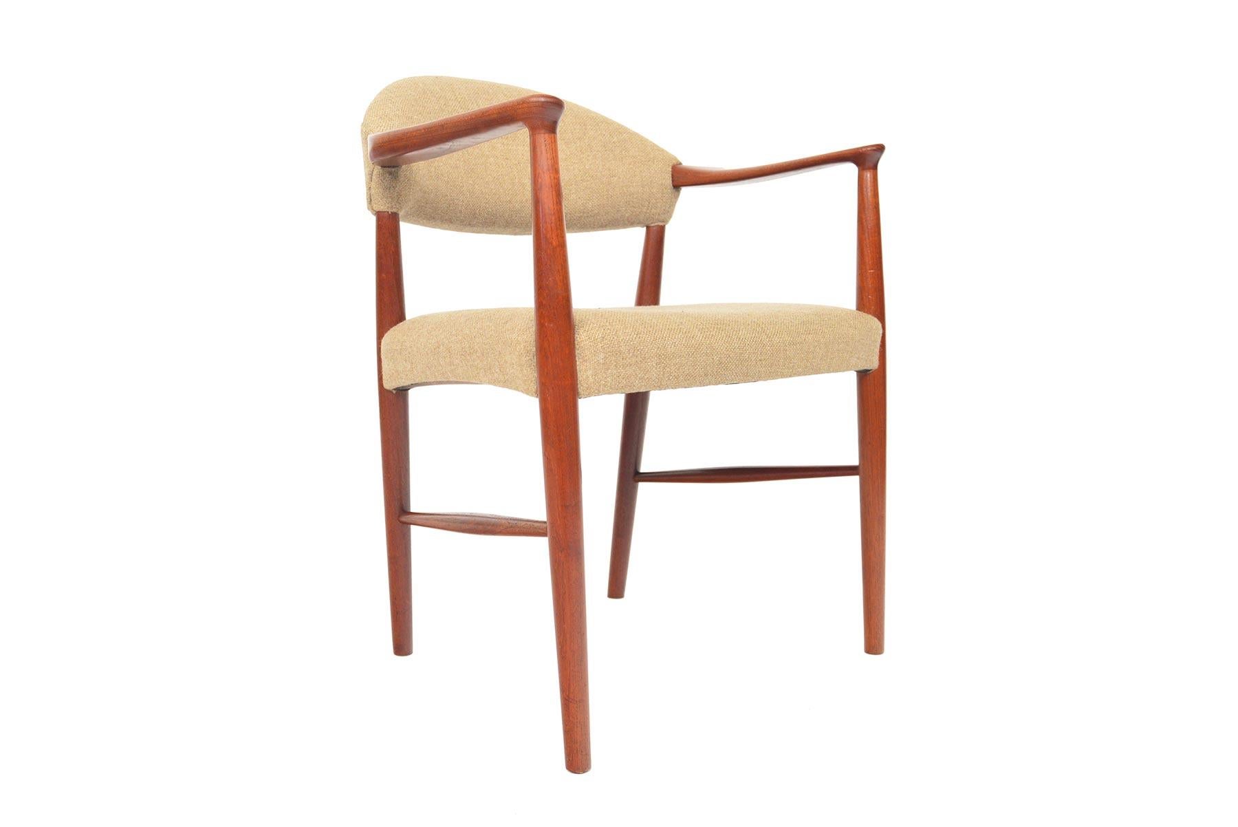 Designed by Kurt Olsen for Slagelse Møbelværk in 1955, this armchair model 223 offers a design that is both timeless and modern. Crafted in beautiful teak, this chair wears its original beige wool upholstery. In excellent original condition with