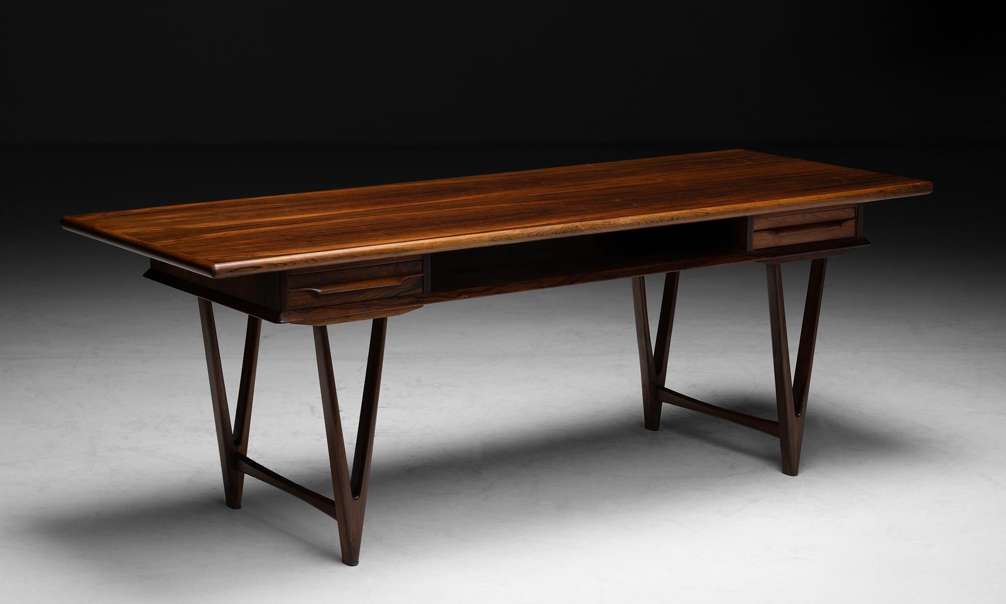 Kurt Ostervig coffee table

Denmark circa 1960

Constructed in solid and veneered Gonçalo alves wood.

Measures: 57”L x 21.75”D x 20.75”H.